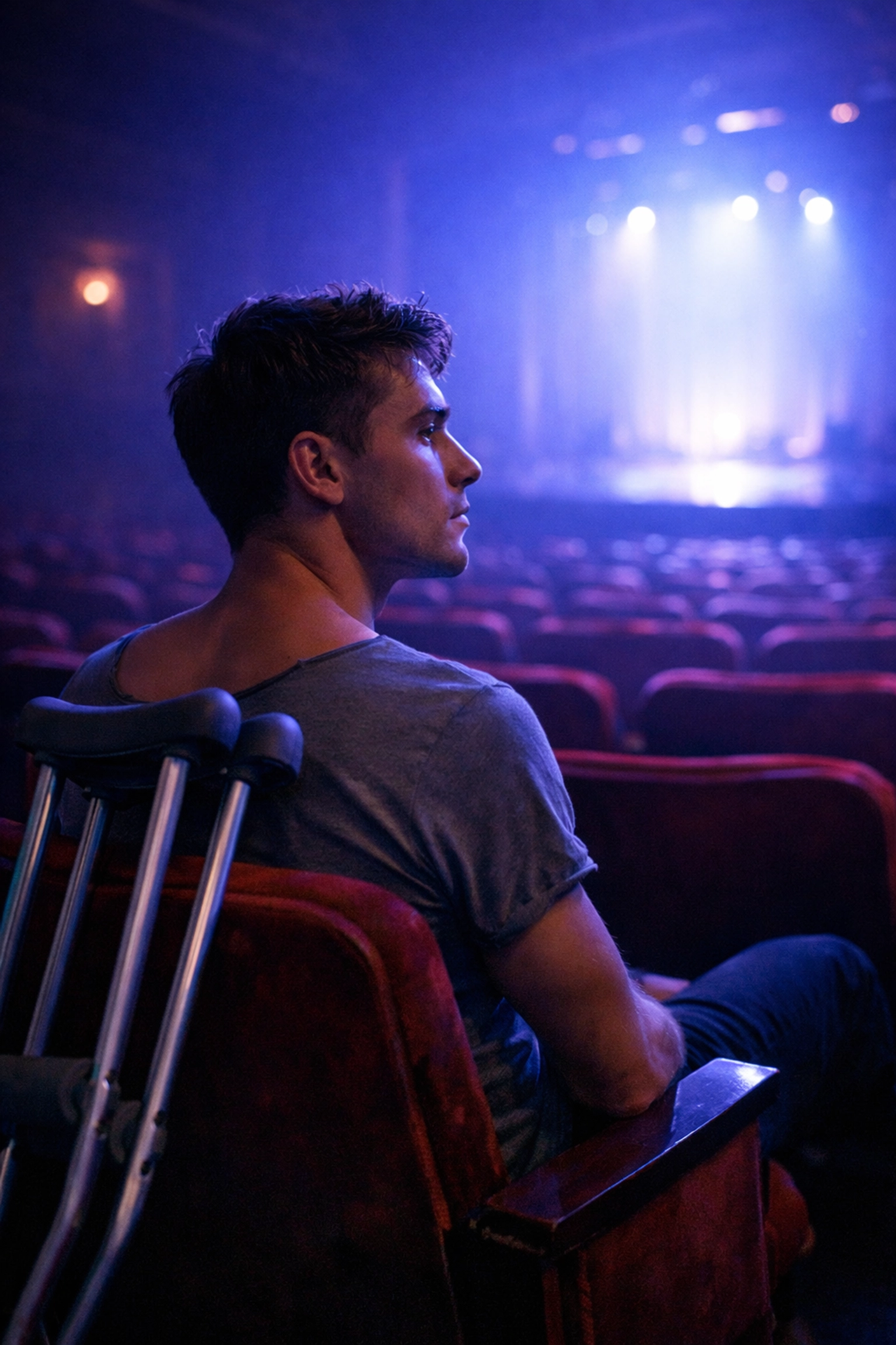 Injured principal dancer reflects from theater seats during recovery - gay ballet romance story
