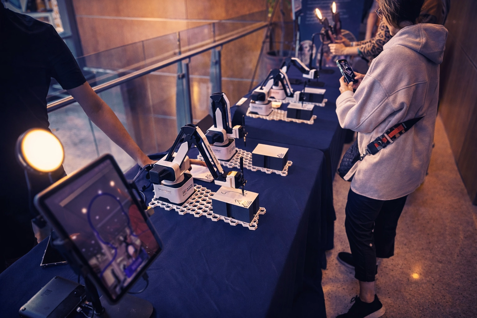 Trade show lead generation with AI Portrait Robot drawing live sketches at a brand activation booth