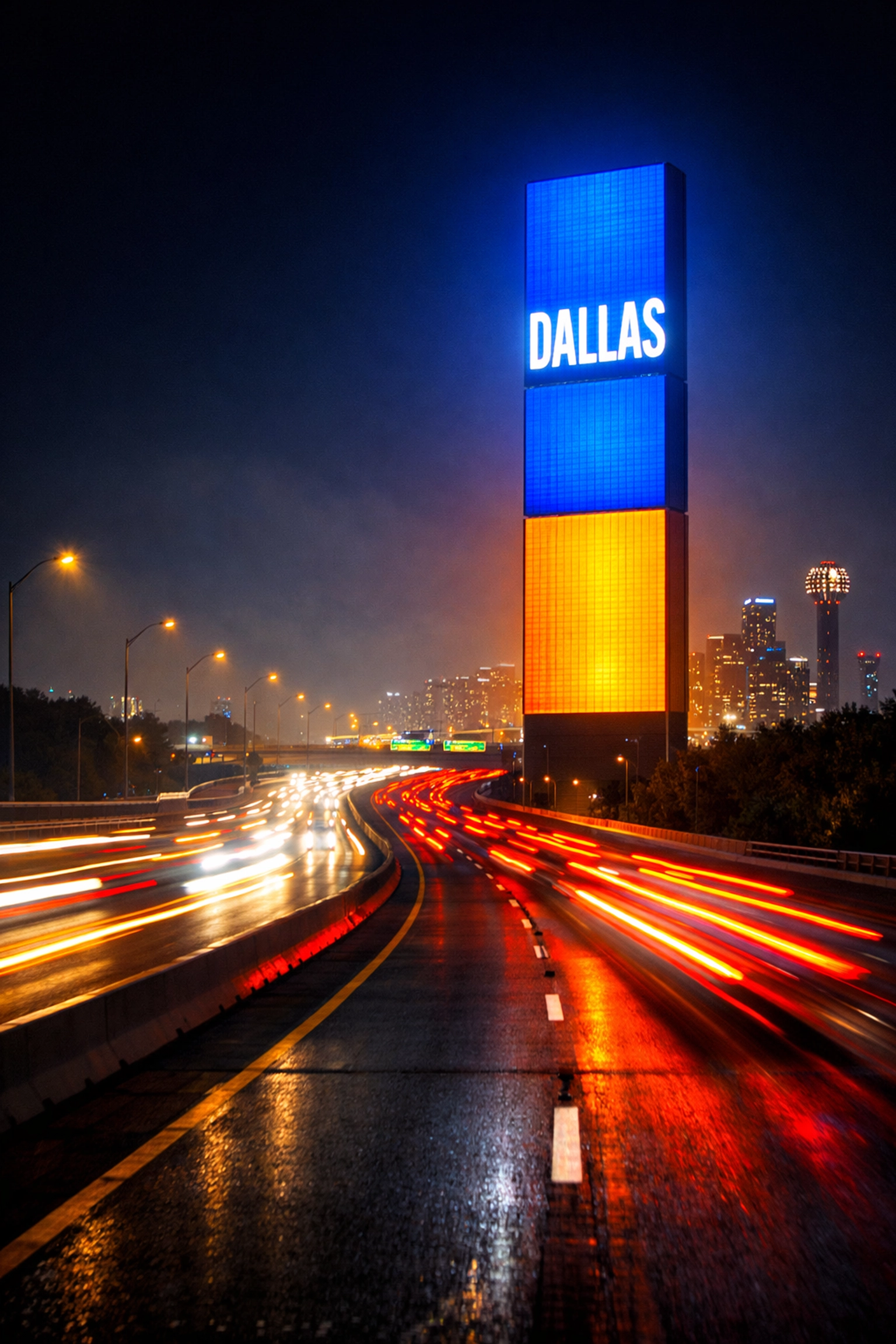 Brightly lit LED pylon sign visible from a busy Dallas highway at night for maximum brand exposure.