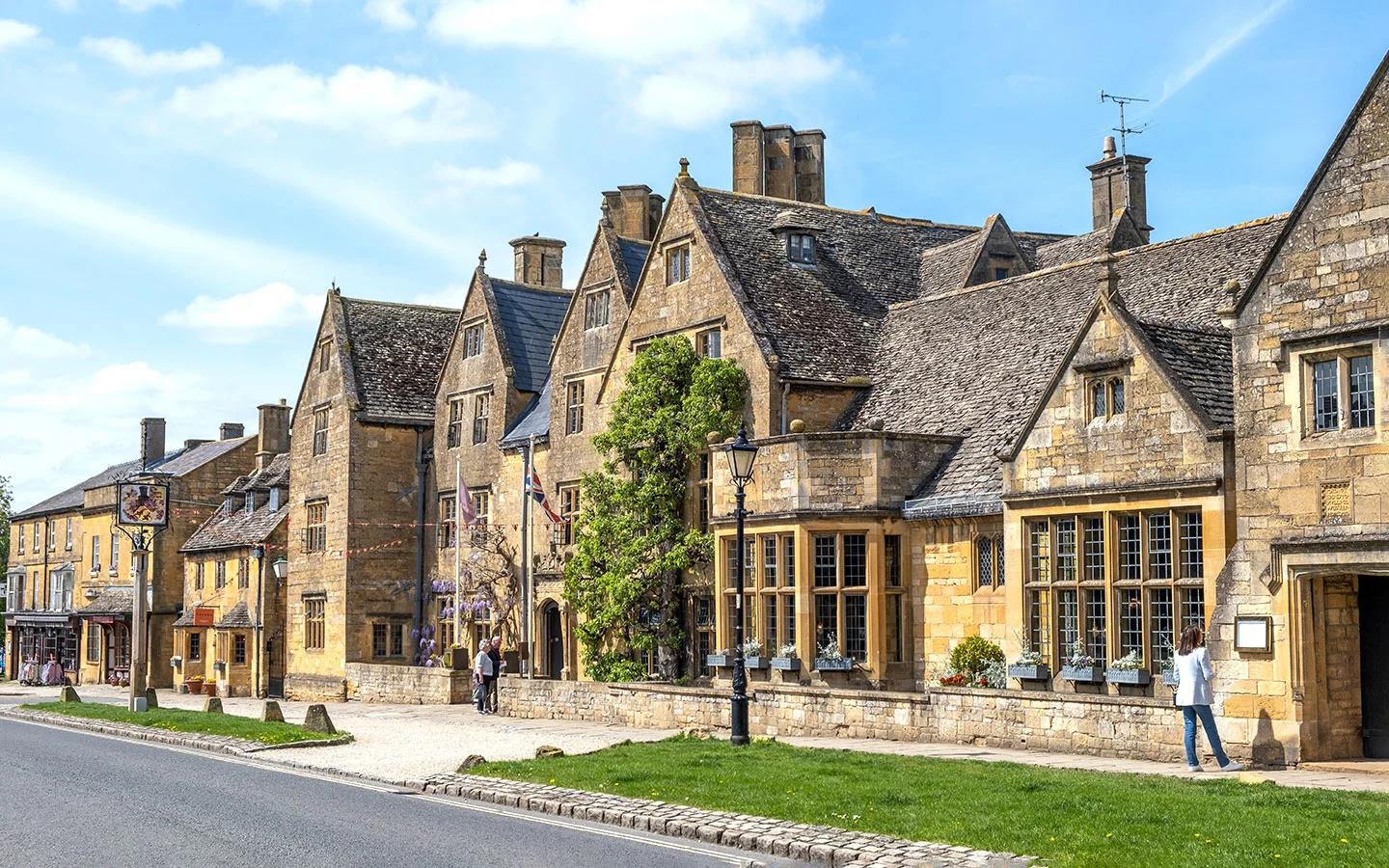 A winter view of Broadway with its picturesque stone buildings and quiet high street.
