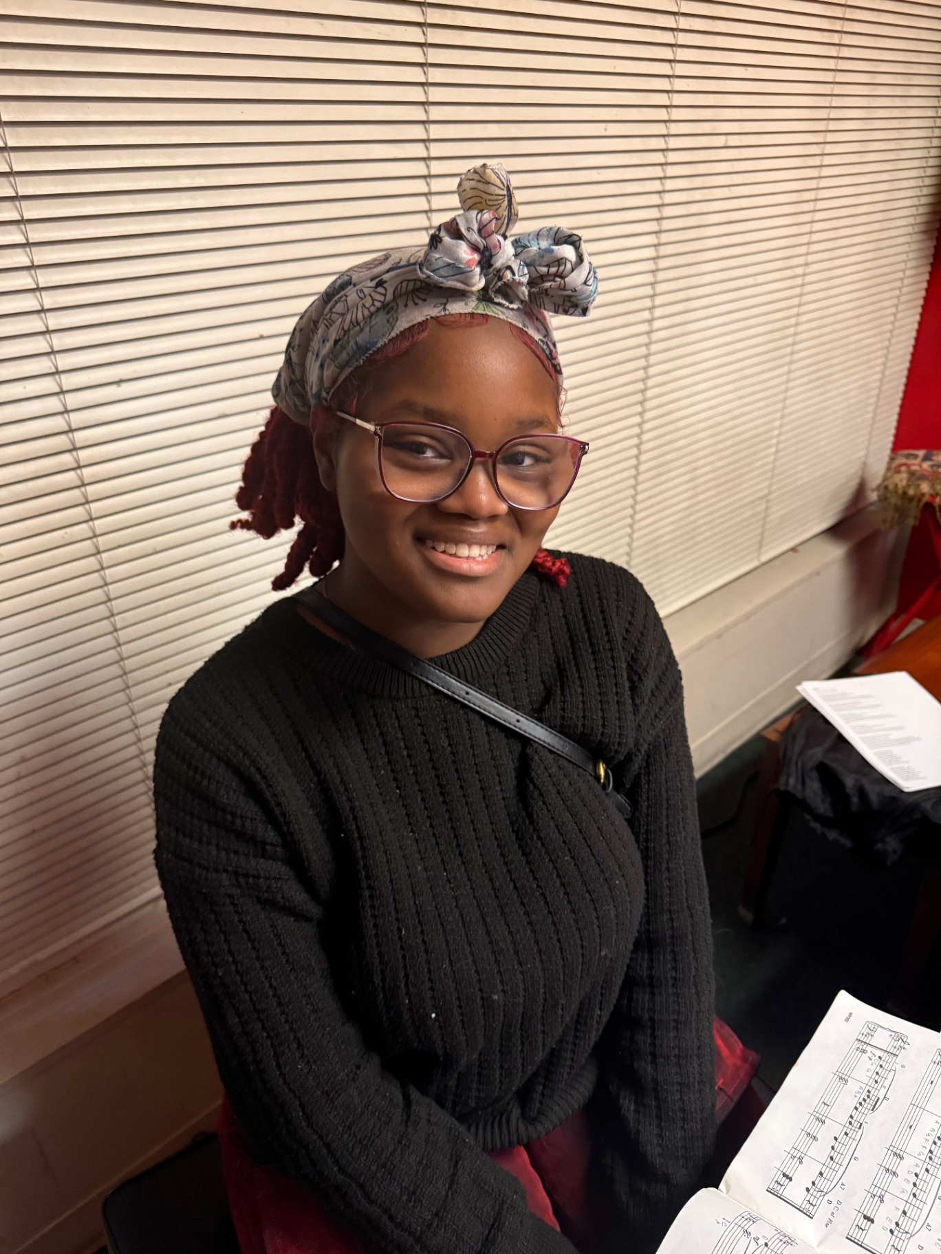 Student at the piano after a lesson