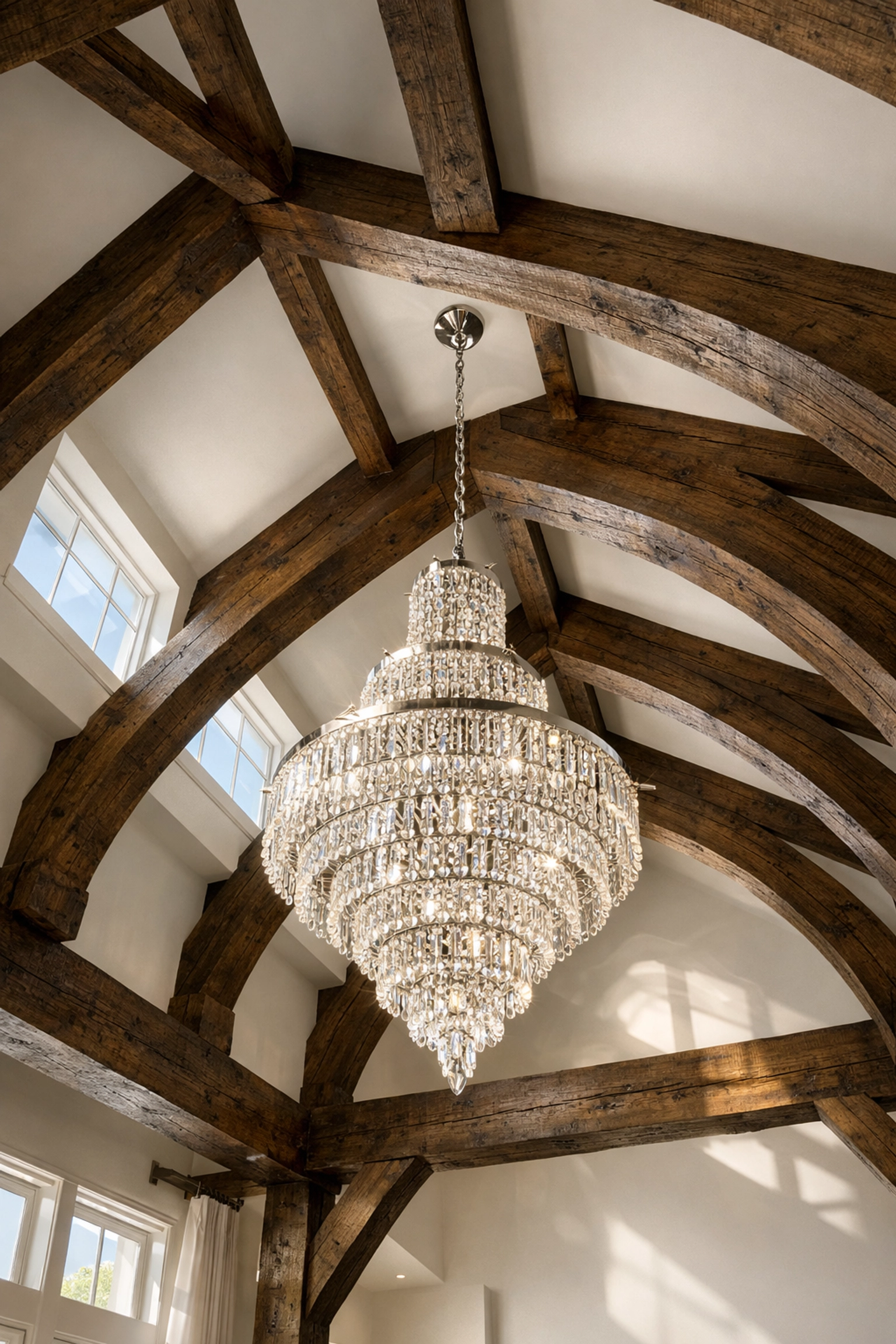 A spotless vaulted ceiling and chandelier in a North Boxford home cleaned by luxury cleaning professionals.