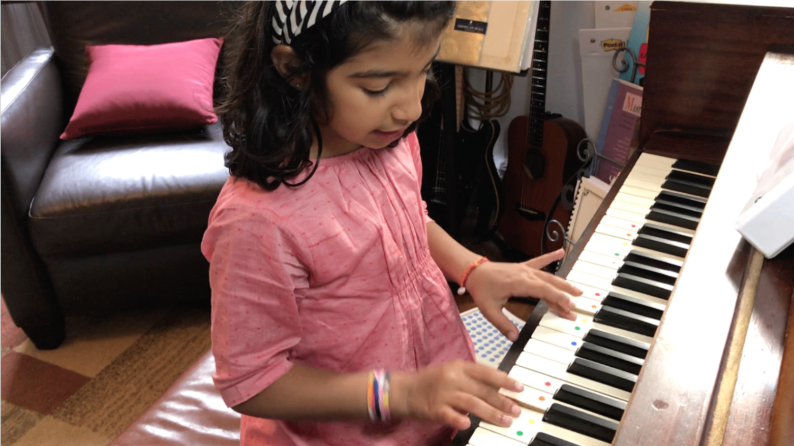 Child Playing Piano at Home