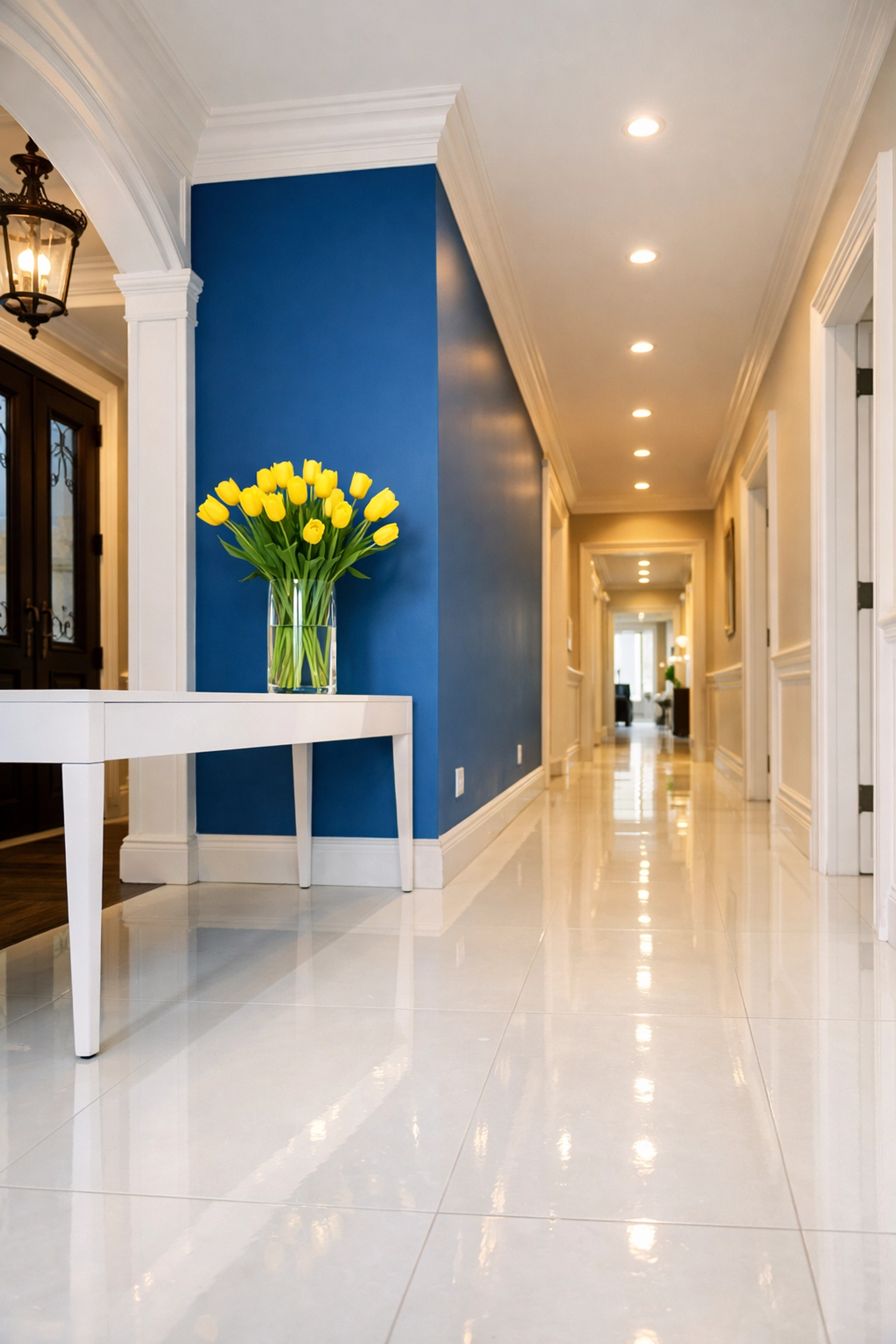 A spotless, sun-filled hallway and entryway, demonstrating thorough house cleaning in a Shrewsbury home.