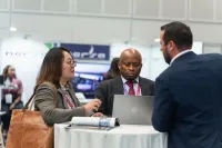 Three business professionals at International Commodity Summit