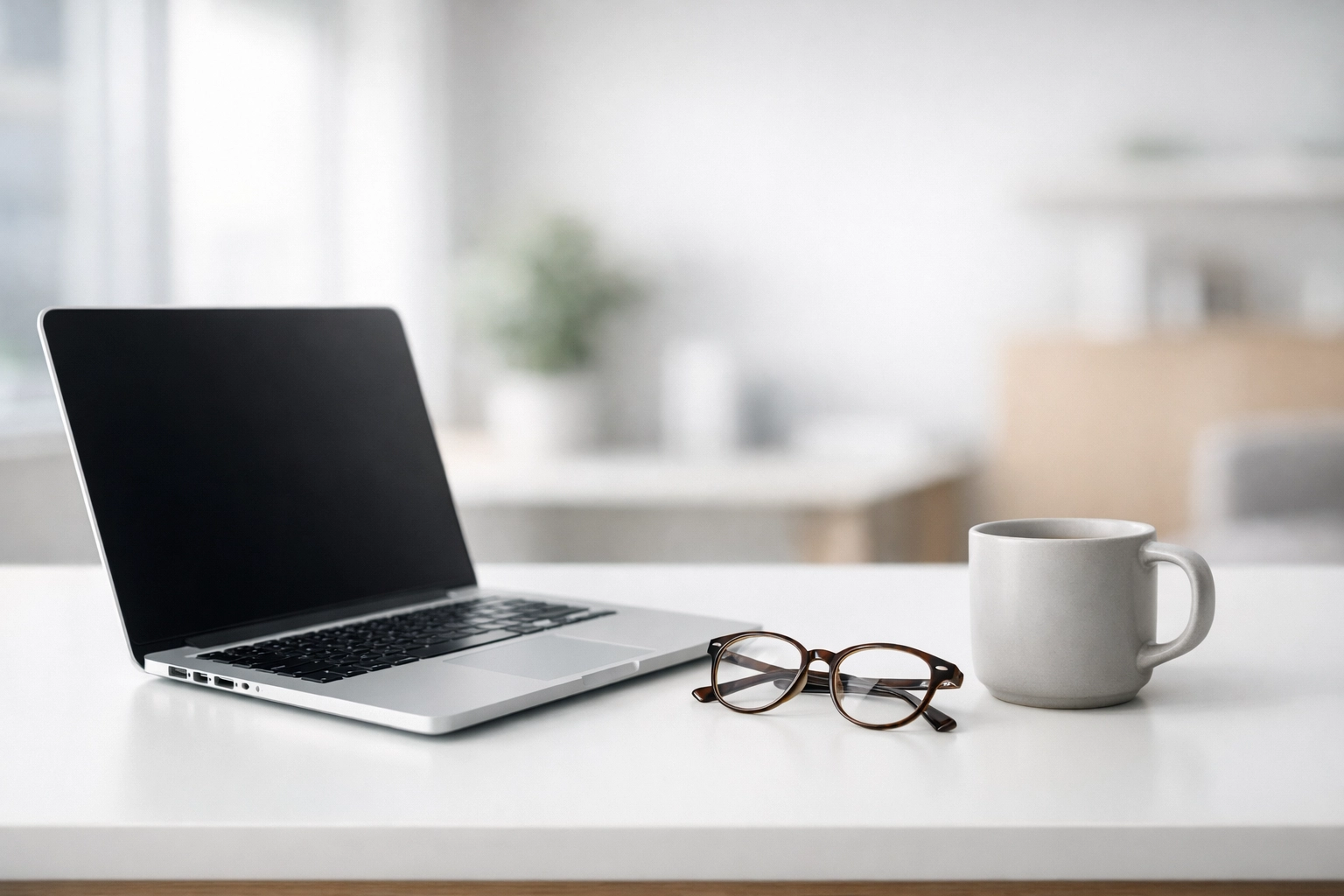 Minimalist tax professional workspace featuring a laptop for secure EFIN management and ERO operations.