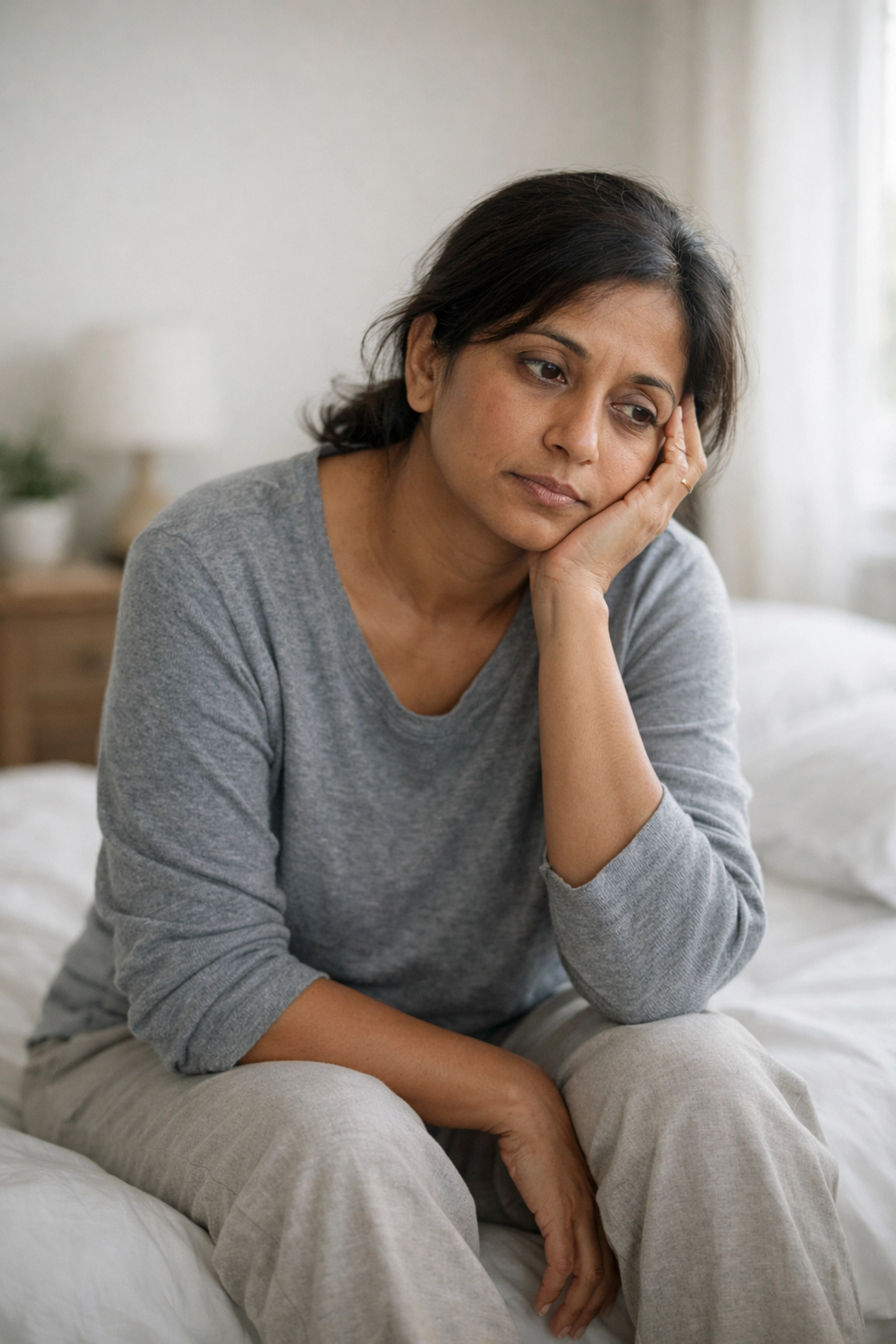 Woman experiencing unexplained chronic fatigue despite normal blood test results