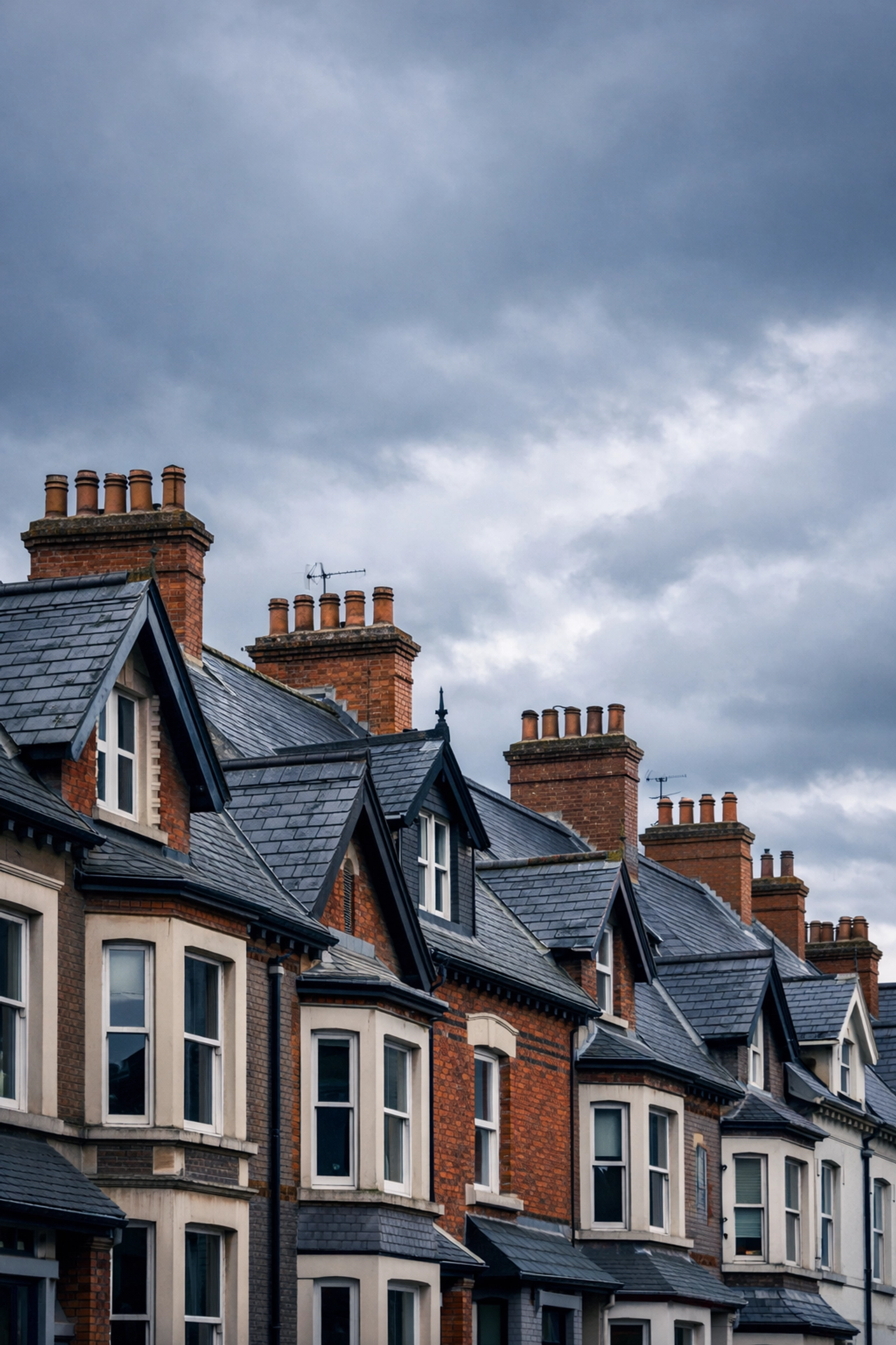 Victorian and Edwardian terraced houses with slate roofs in Lisburn requiring professional surveys