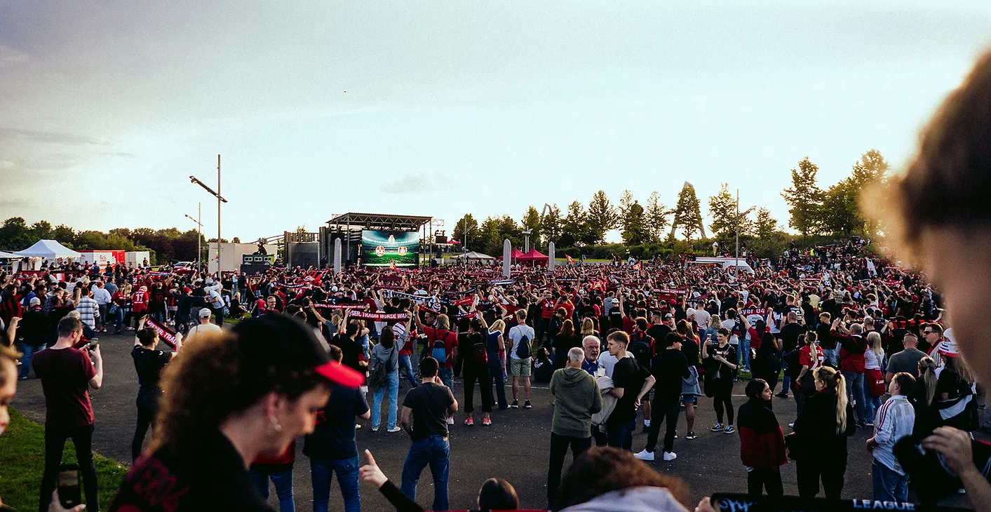 Large outdoor event with technical infrastructure supporting the crowd