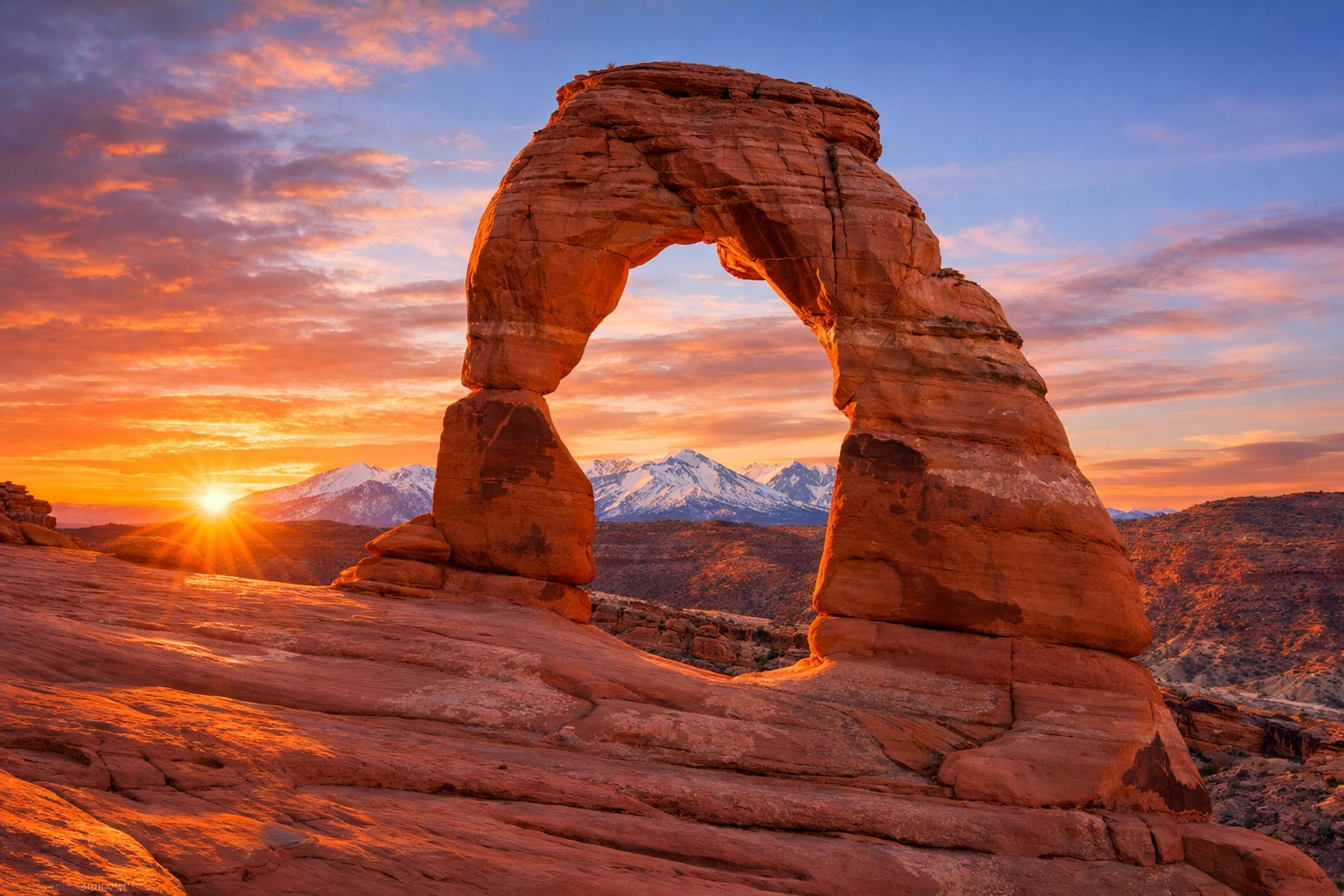 Sunset at Delicate Arch in Utah, a top choice for landscape photography locations in national parks.