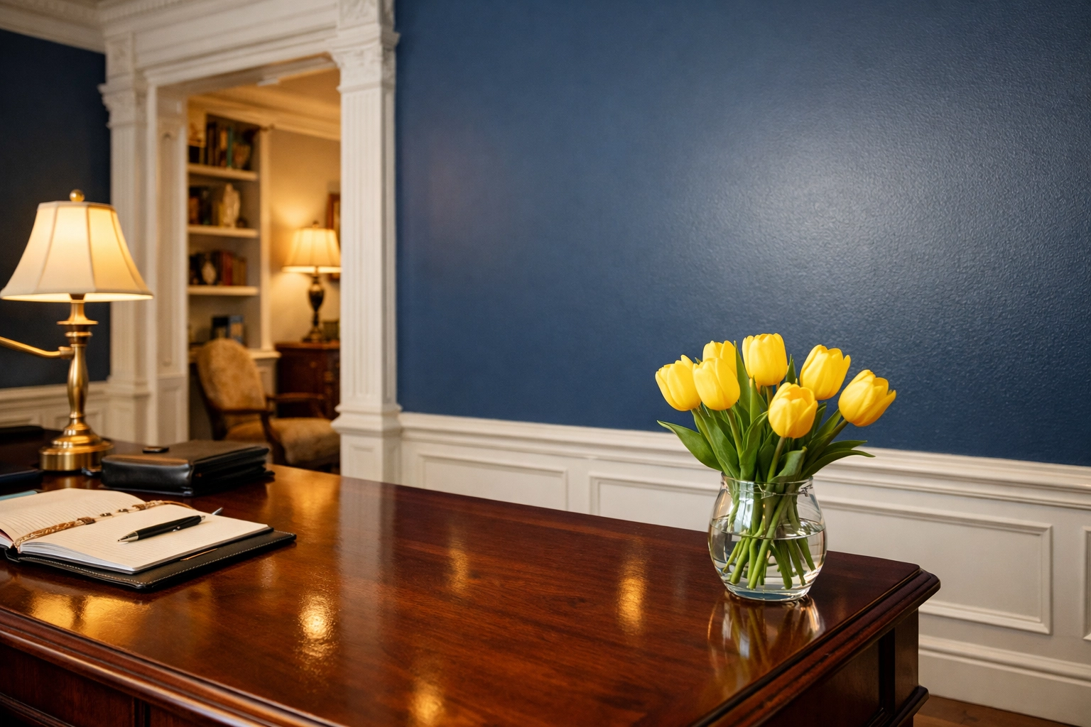 Clean boutique office in Leominster featuring a mahogany desk and spotless white baseboards.