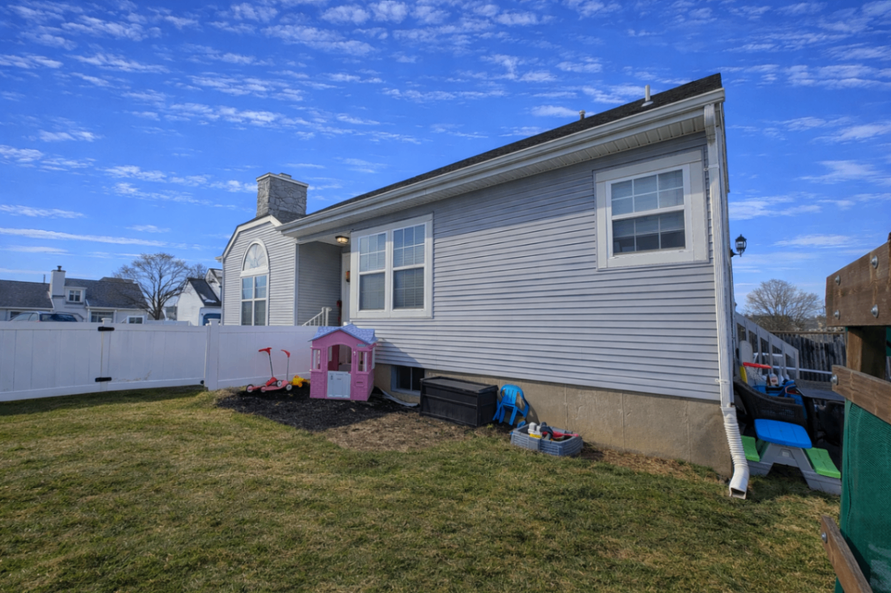 Front exterior photo of the Burlington Township NJ home showing curb appeal for a coming soon 4-bedroom listing with dual primary suites Front exterior photo of the Burlington Township NJ home showing curb appeal for a coming soon 4-bedroom listing with dual primary suites