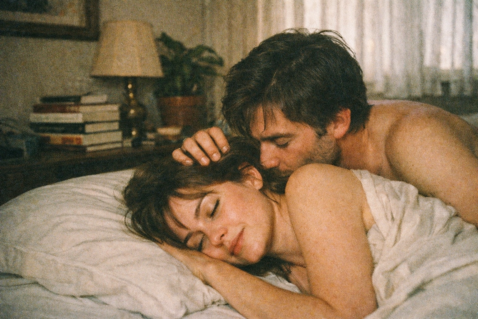 Couple during post-orgasm aftercare with tender kissing and connection