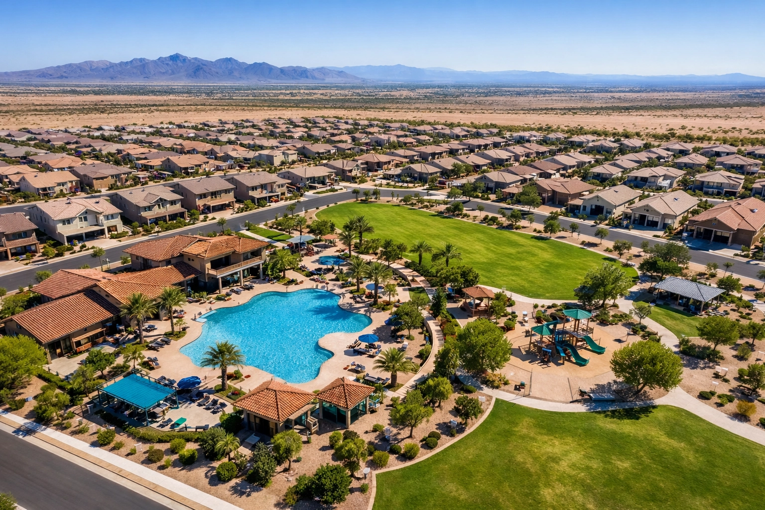 Aerial view of a master-planned neighborhood in Buckeye AZ showcasing modern homes and community amenities. Aerial view of a master-planned neighborhood in Buckeye AZ showcasing modern homes and community amenities.