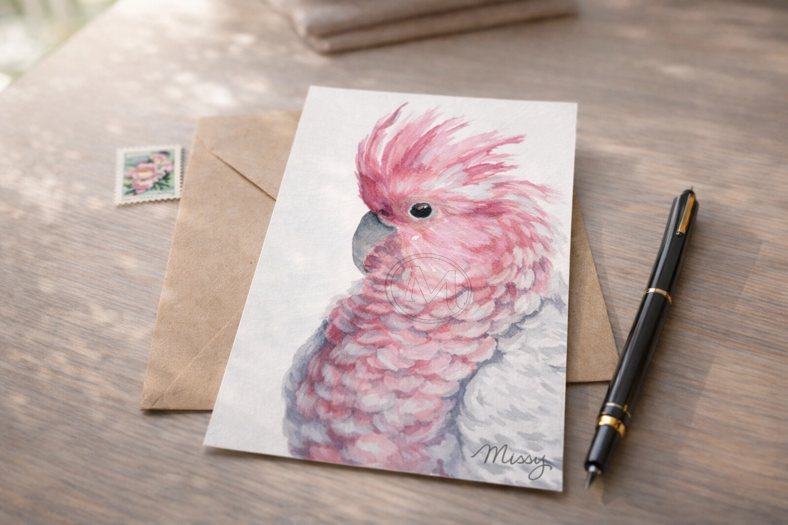 Missy’s Major Mitchell’s Cockatoo watercolor masterpiece in a cozy snail-mail desk mockup (watermark visible)