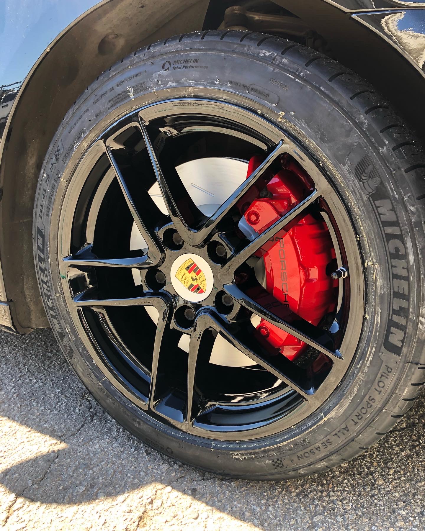 Porsche Wheel with Custom Gloss Black Rim and Red Powder Coated Brake Caliper