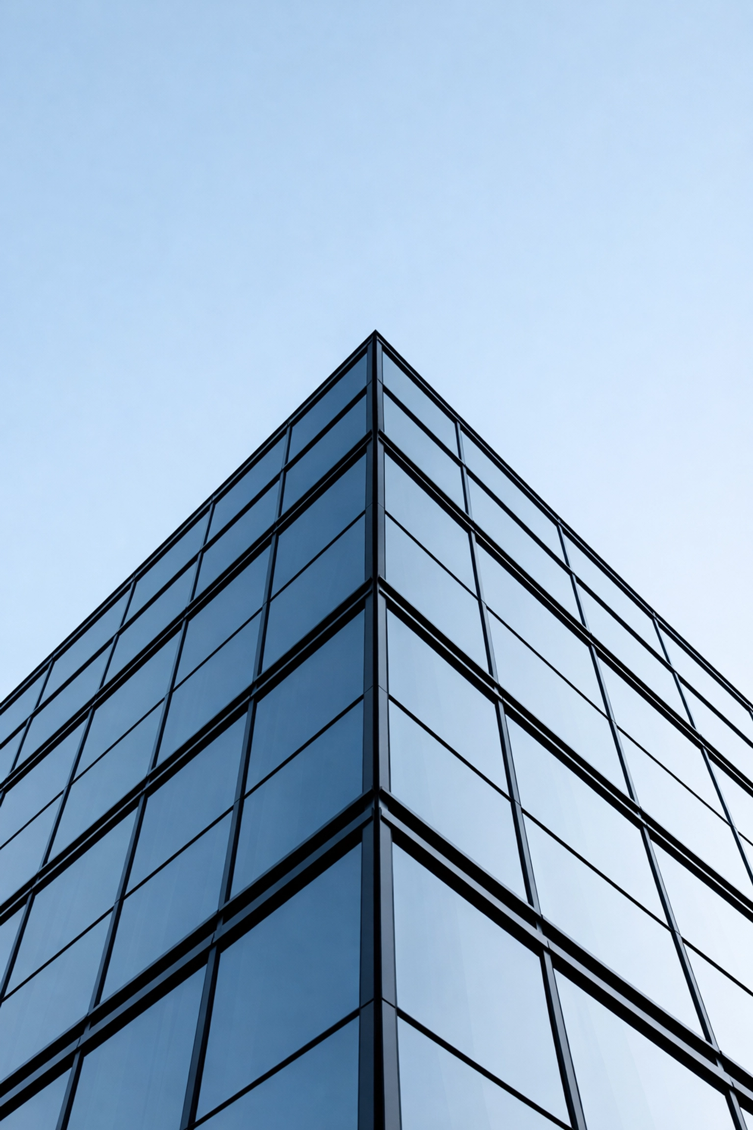 Modern glass building symbolizing structural integrity and transparency in Vietnam's business sector.