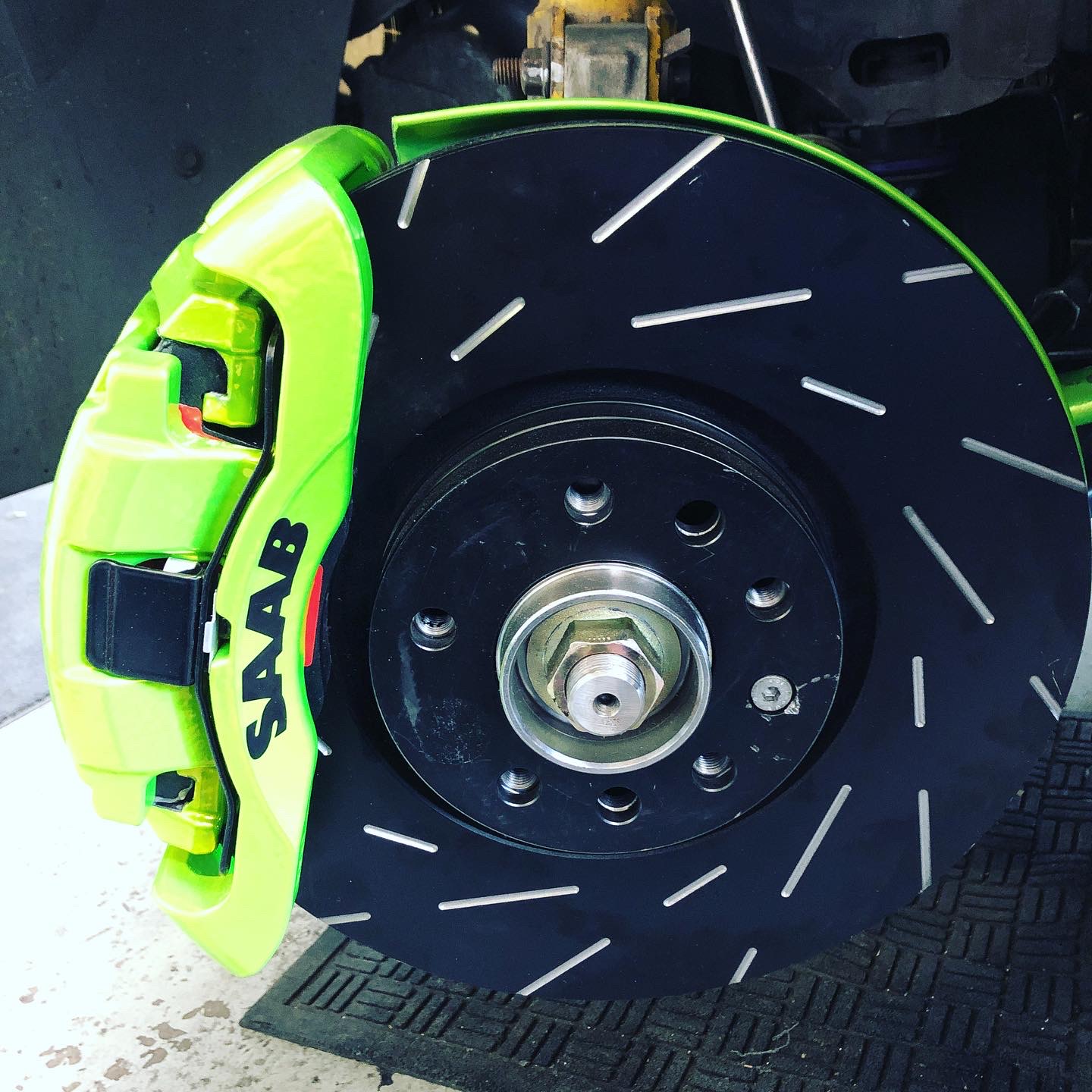 Blue SAAB brake caliper powder coated to add a cool, high-contrast option alongside red finishes.