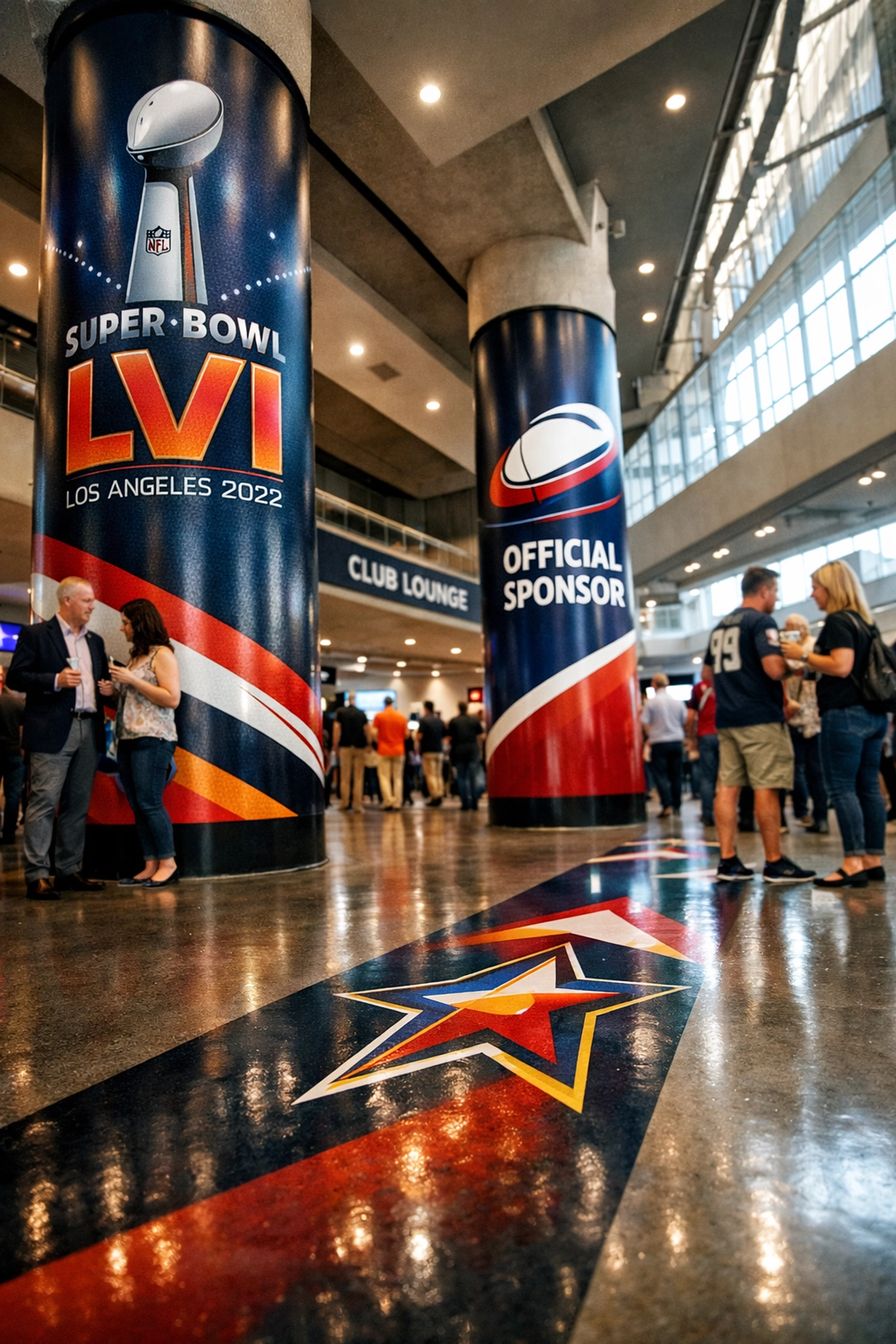 Immersive Super Bowl concourse advertising with branded pillar wraps and directional floor graphics.