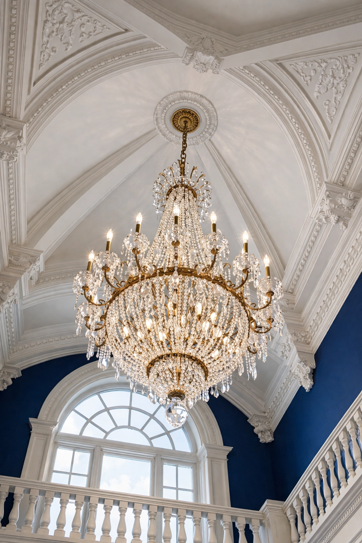 Crystal chandelier and high vaulted ceilings cleaned by residential cleaning Massachusetts experts.