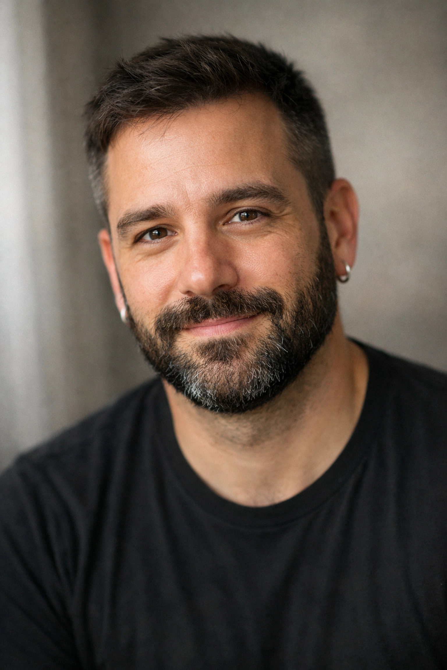 Man with gentle expression representing trust and safety in gay romance and kink relationships