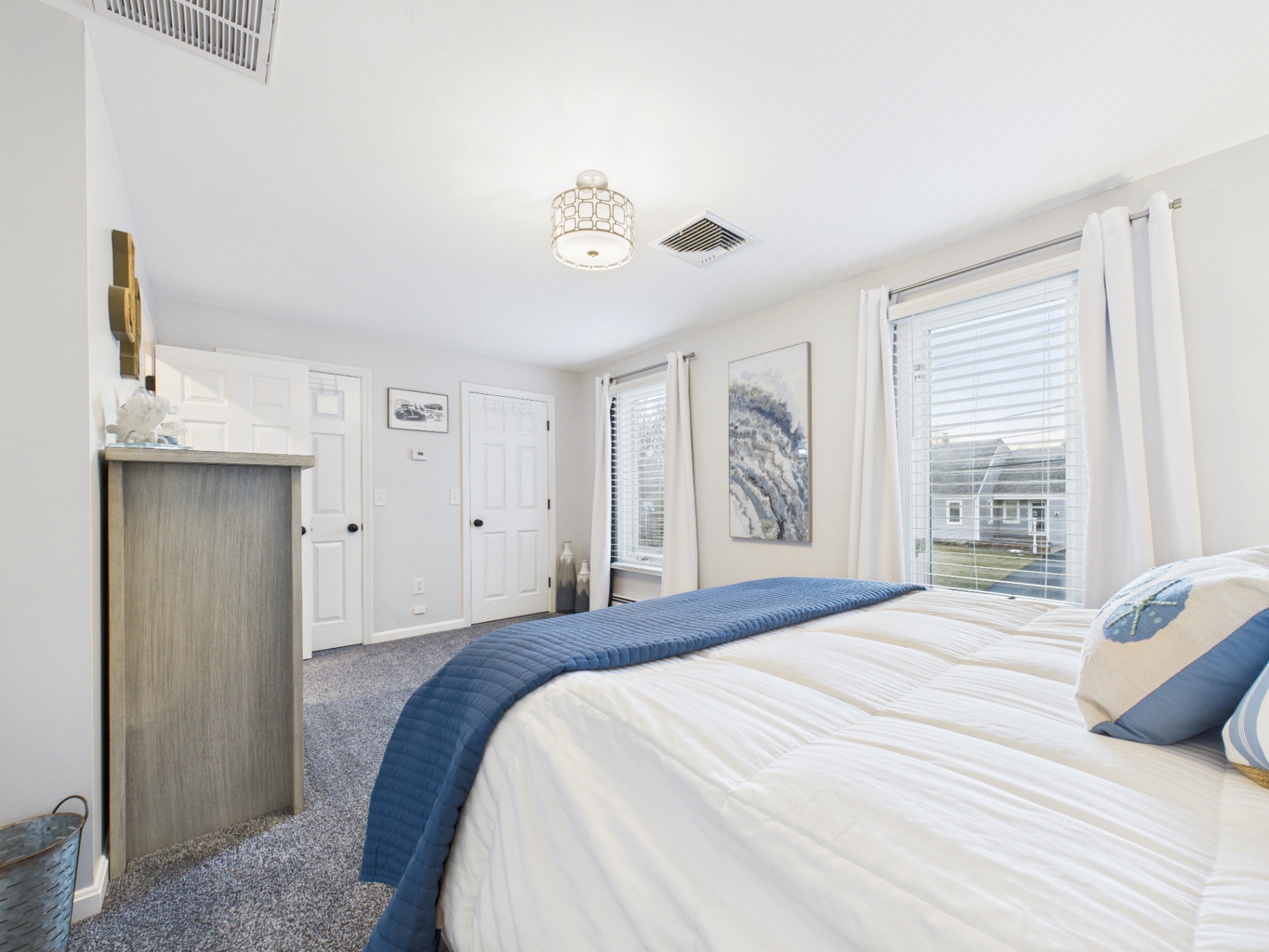 Bright, Spacious Bedroom with Modern Coastal Decor