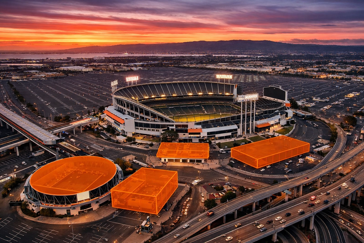 Aerial view of empty Oakland Coliseum complex showing Mount Davis and 112-acre redevelopment site