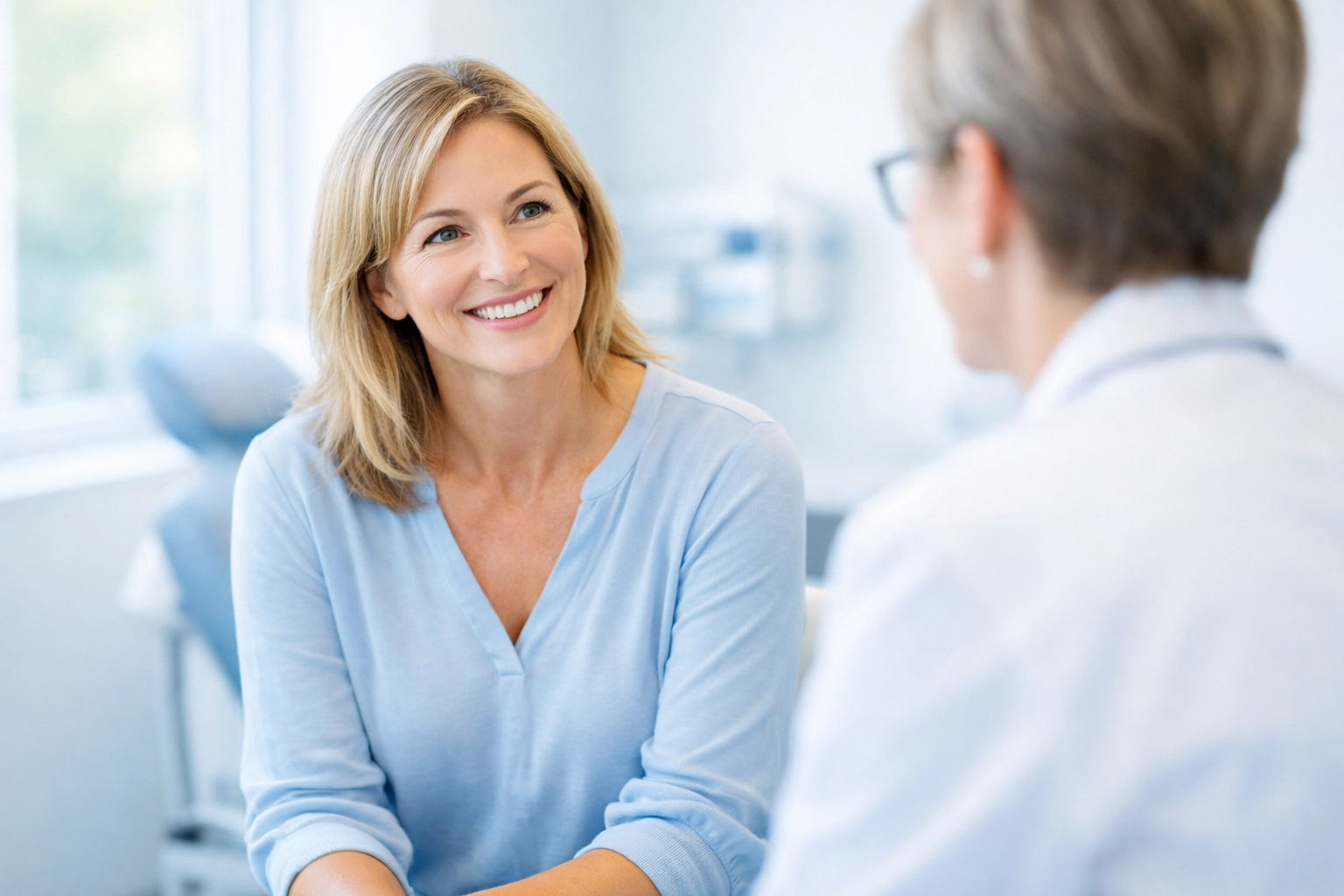 A patient consulting with a healthcare specialist about PPO vs EPO medical plan options in California.