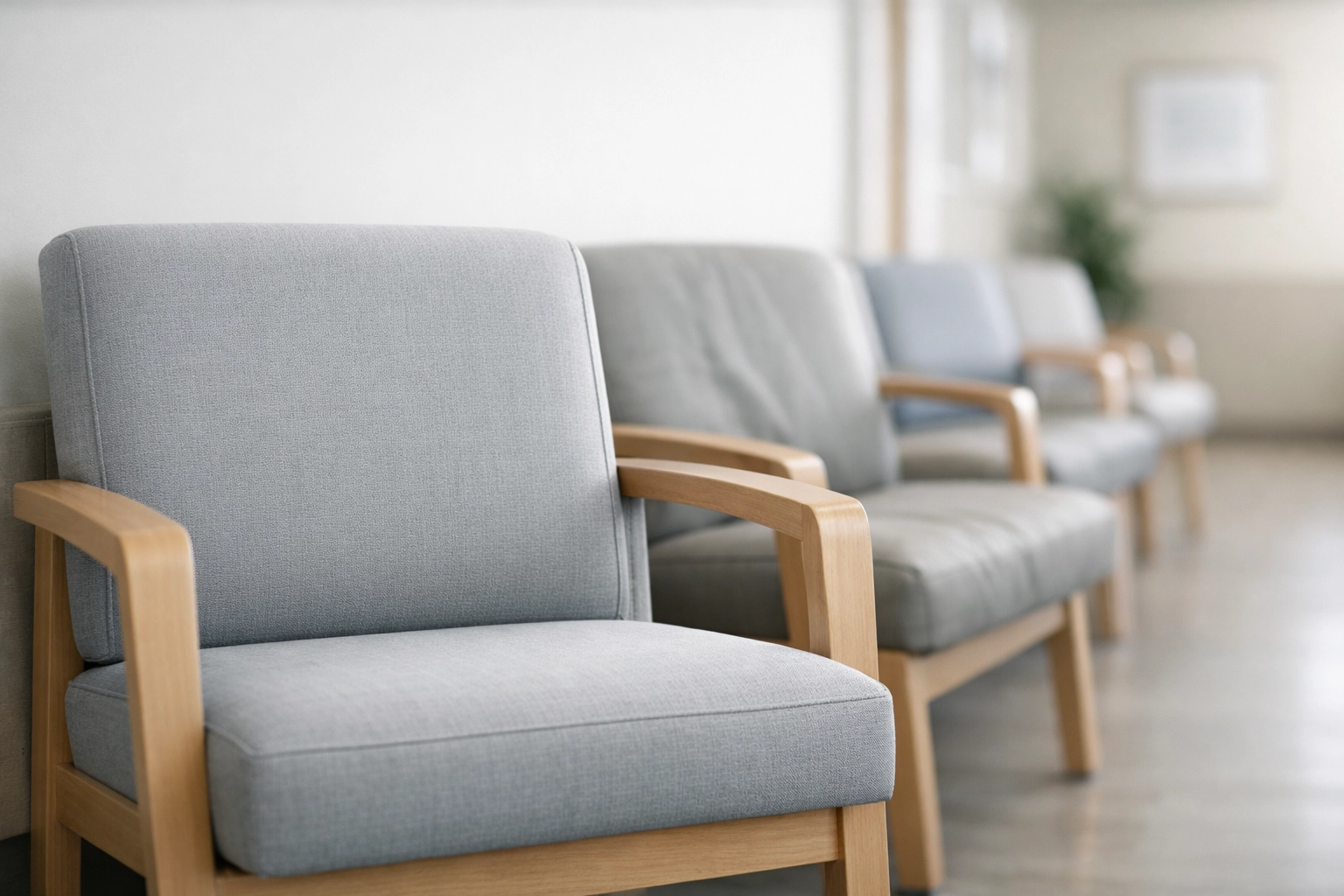 Durable upholstered chairs in a modern clinic waiting room designed for patient comfort and trust.