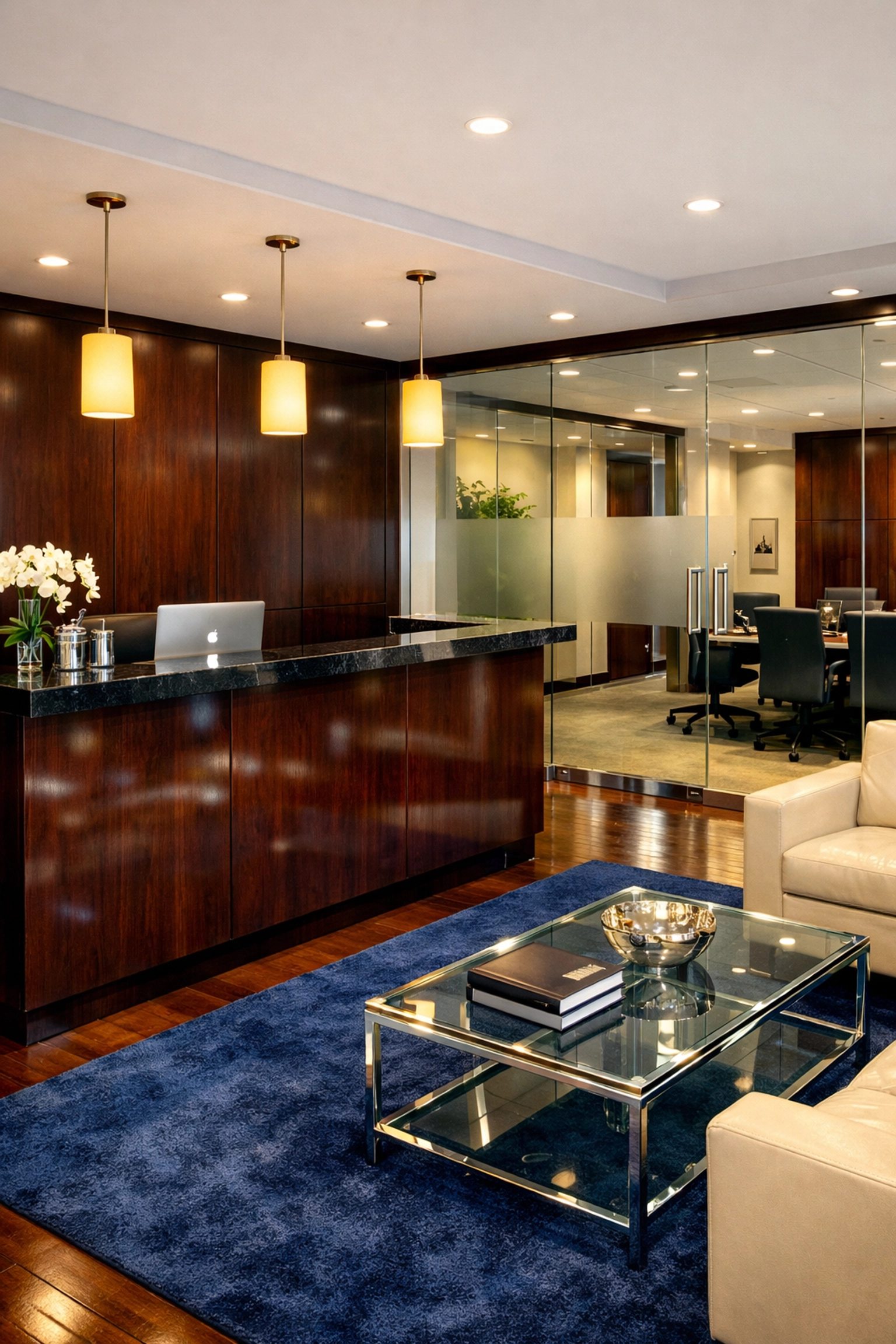 Streak-free glass and polished reception desk in a professional suite cleaned by Hudson experts.