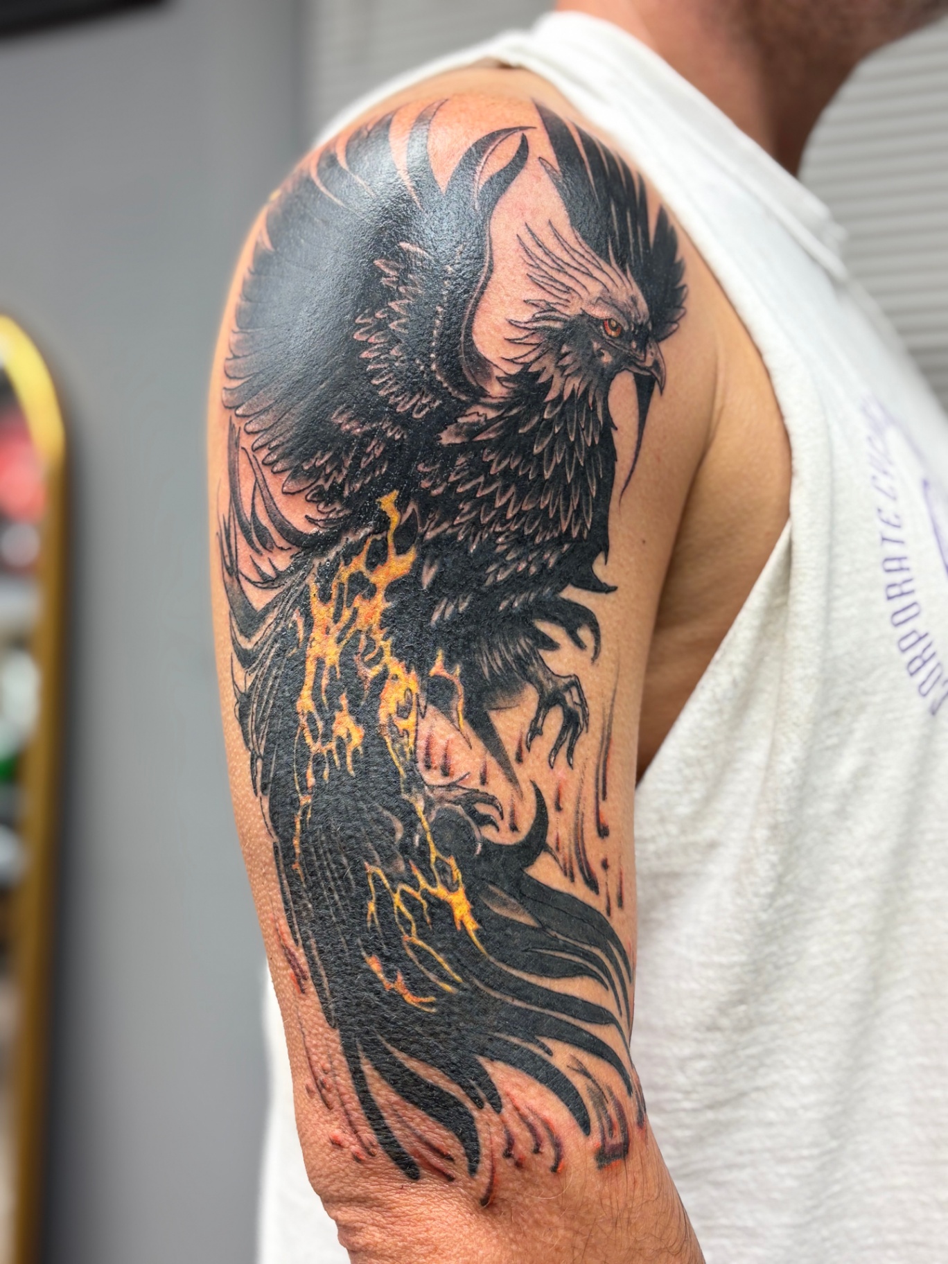 Large custom realism phoenix tattoo