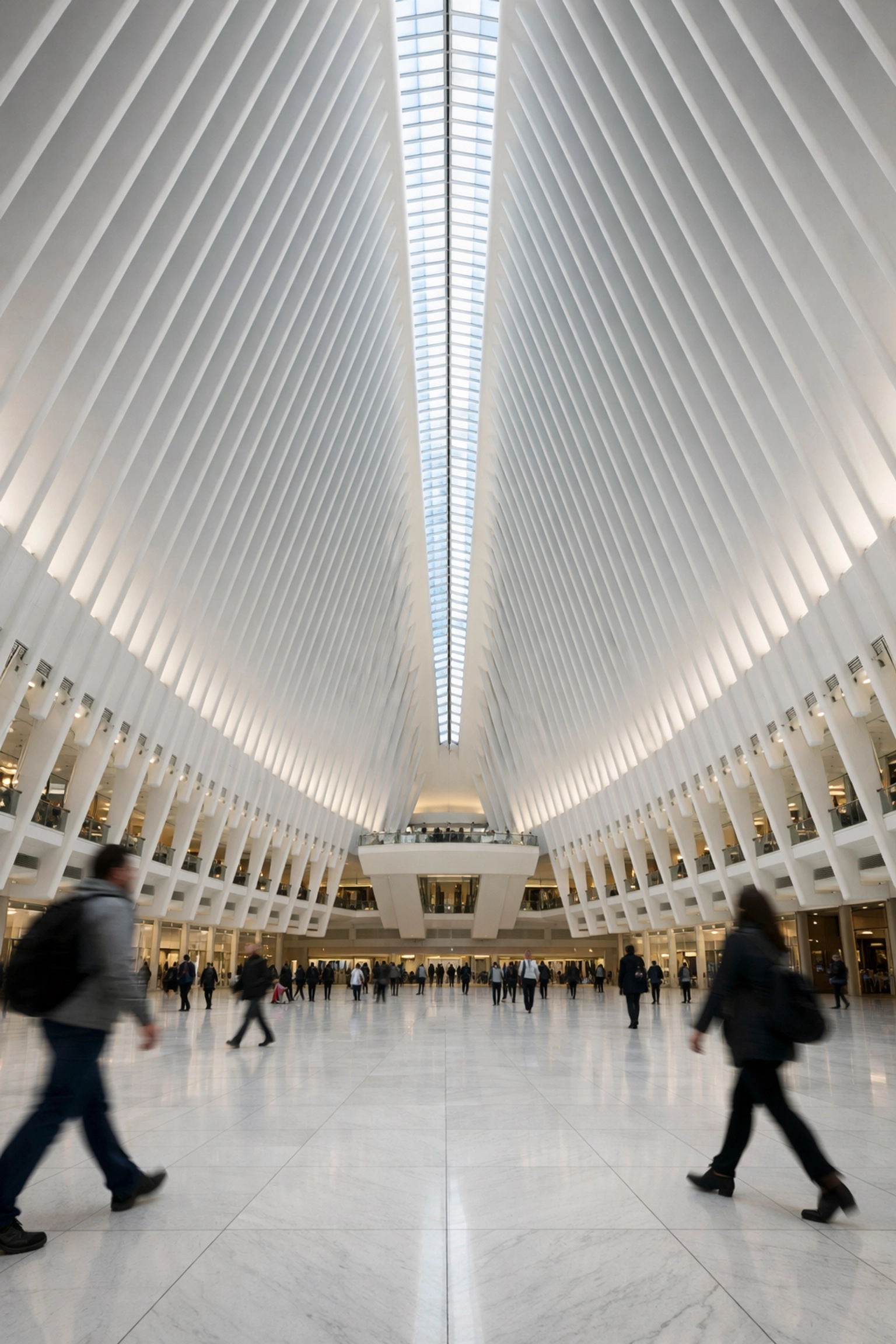 Symmetrical white interior of The Oculus at World Trade Center, a prime NYC photography spot.