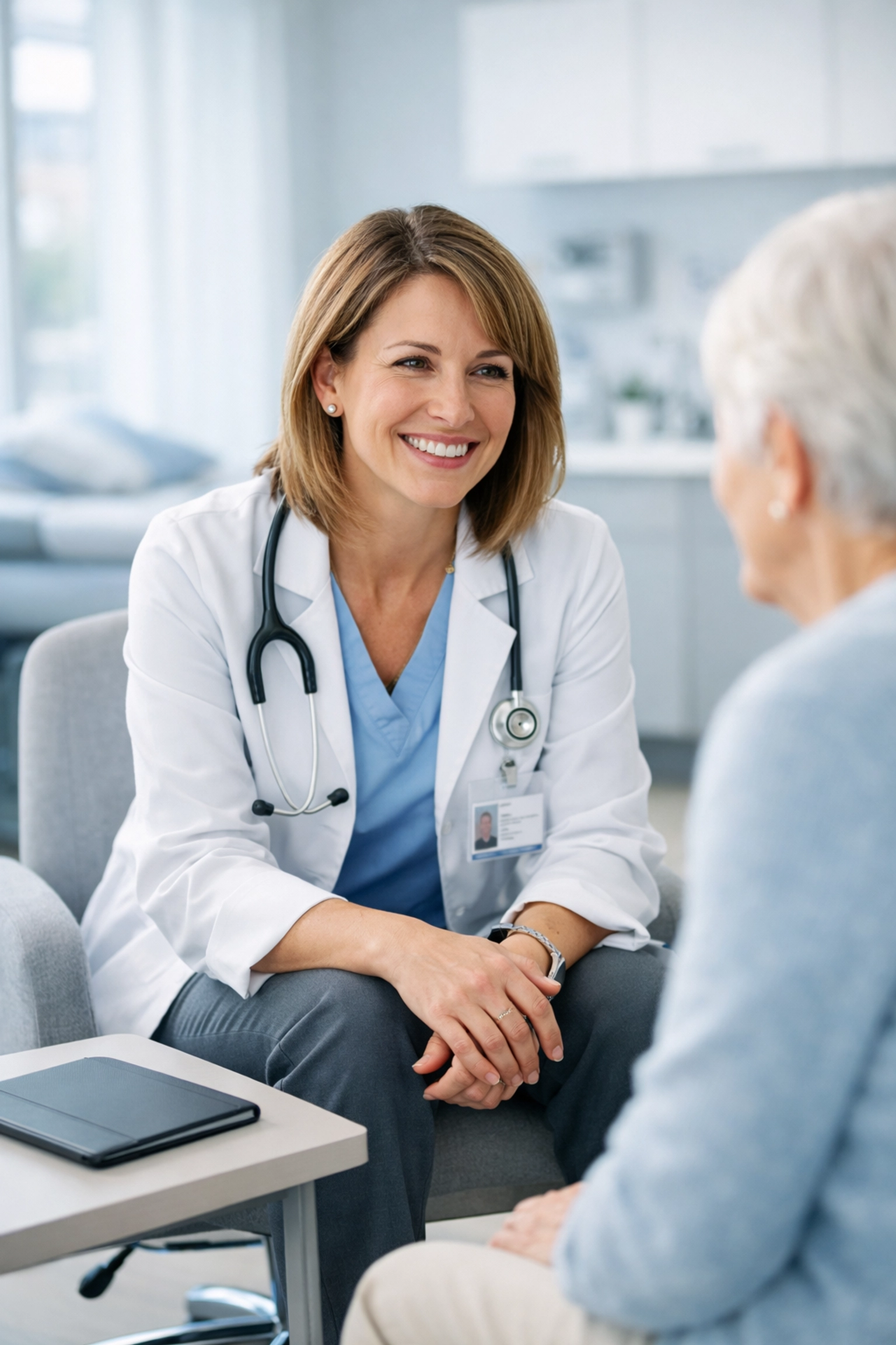 Nurse practitioner engaging with a patient, demonstrating how AI clinical documentation improves patient focus.