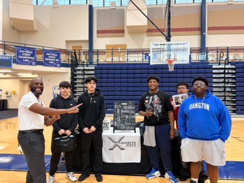 Hamilton HS Career Fair - Group Photo 2 Rodriguis Hampton and students at the X Quest booth at Hamilton HS.