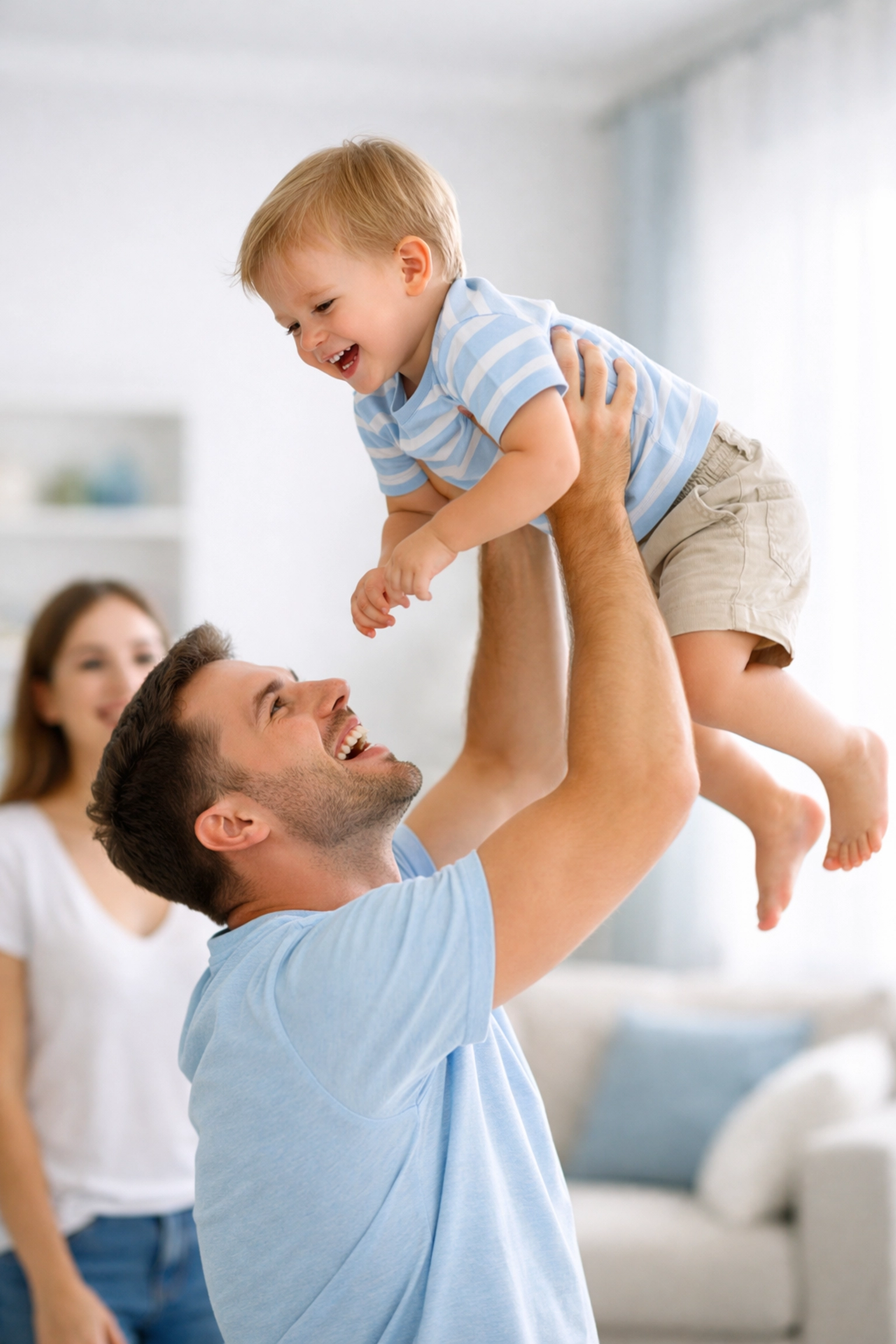 A happy family in a bright living room representing financial security through life insurance.