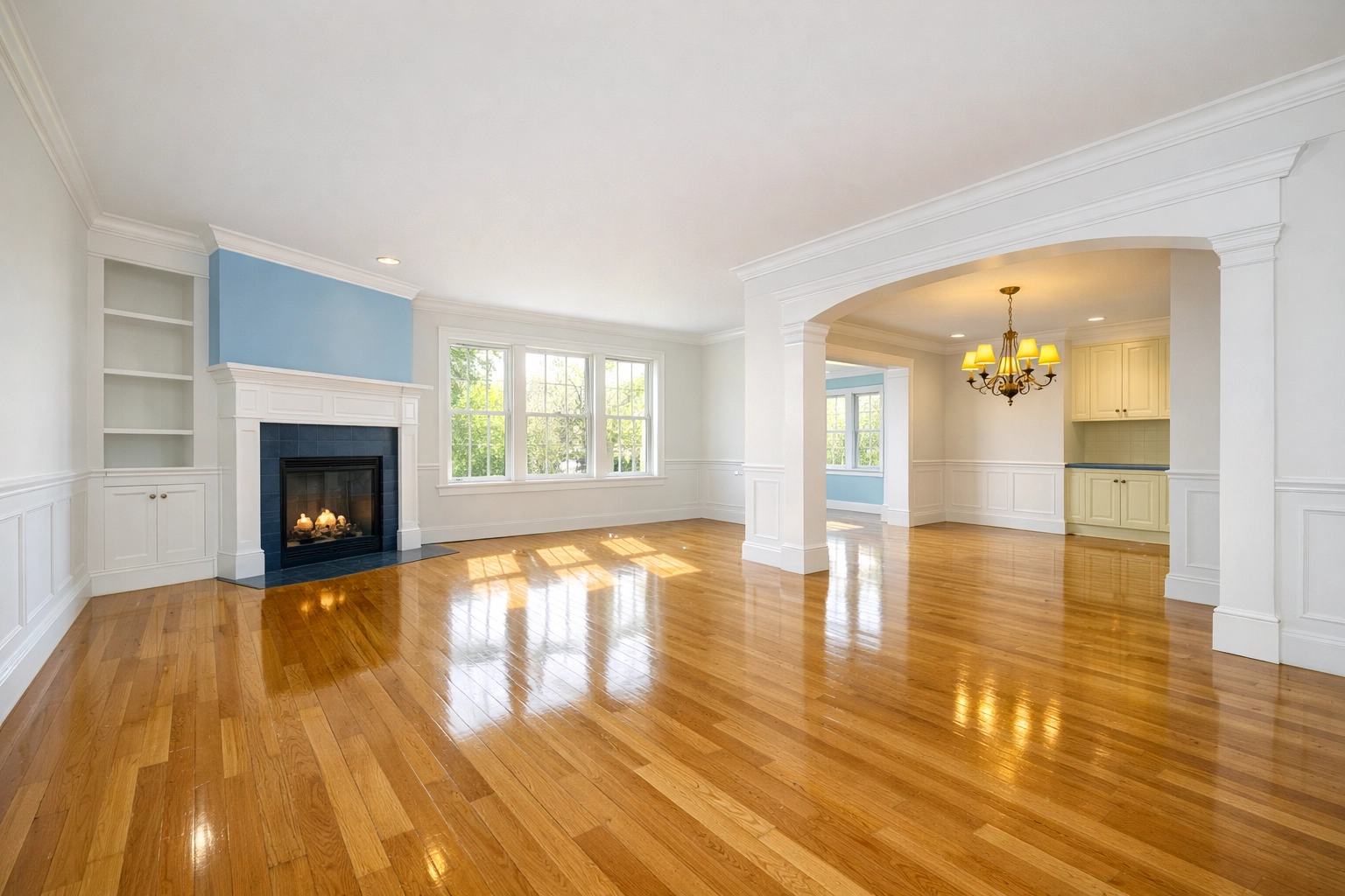 Immaculate living room with polished hardwood floors after a professional house cleaning.