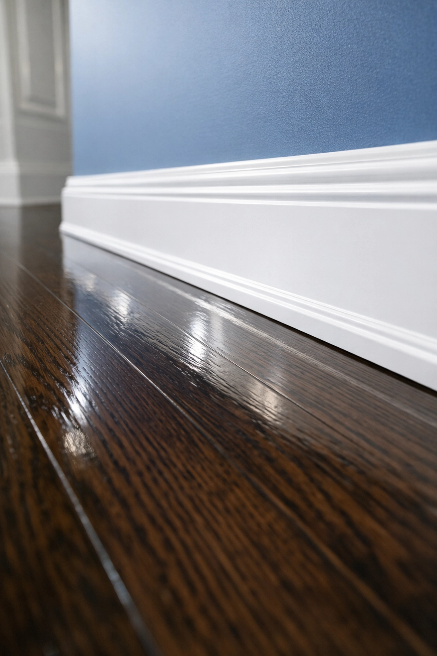 Pristine dark oak floors and white baseboards highlighting deep clean house cleaning services MA standards.