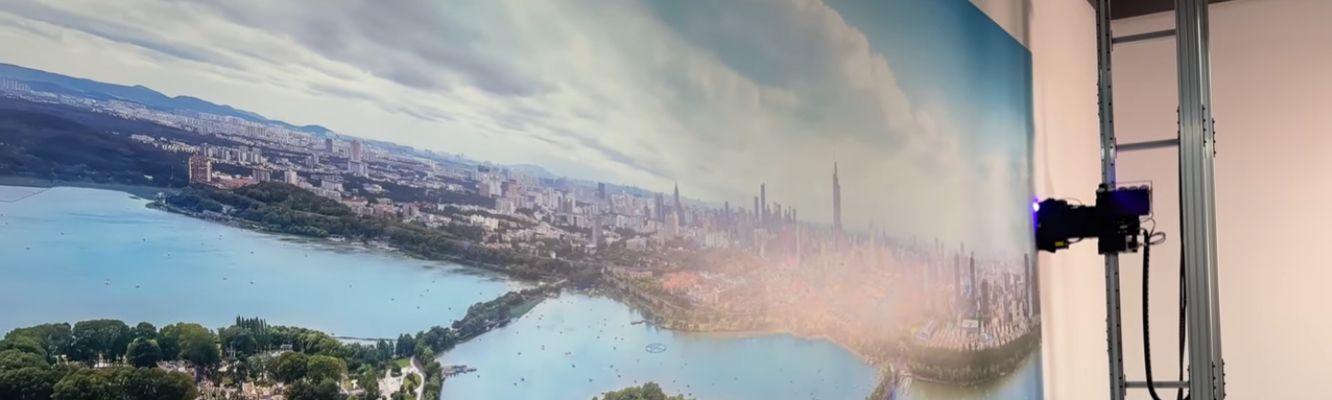 High-precision vertical wall printer in action, producing a large-format cityscape mural directly onto a smooth wall surface.