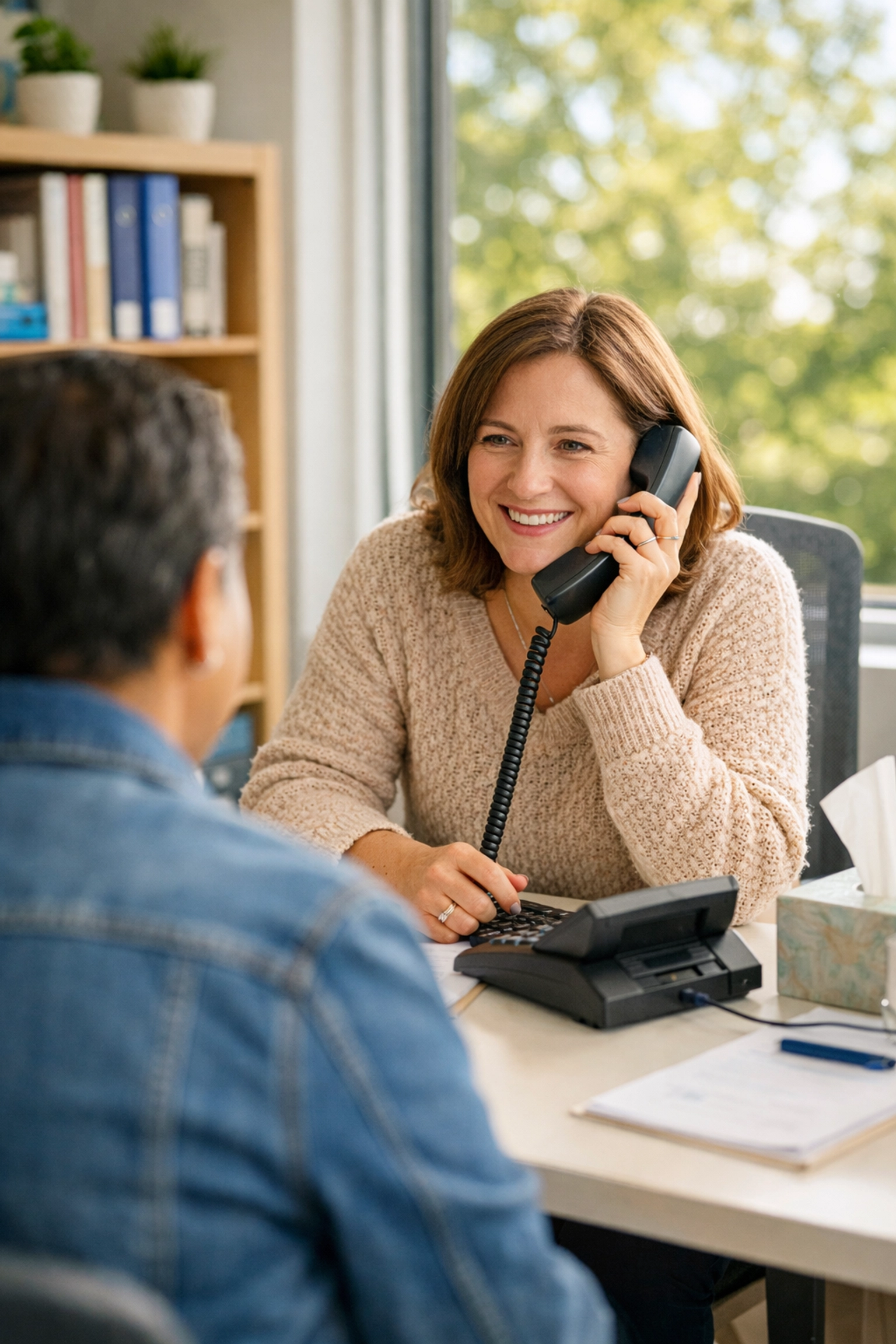 Compassionate community support specialist helping a family navigate South Jersey assistance programs.