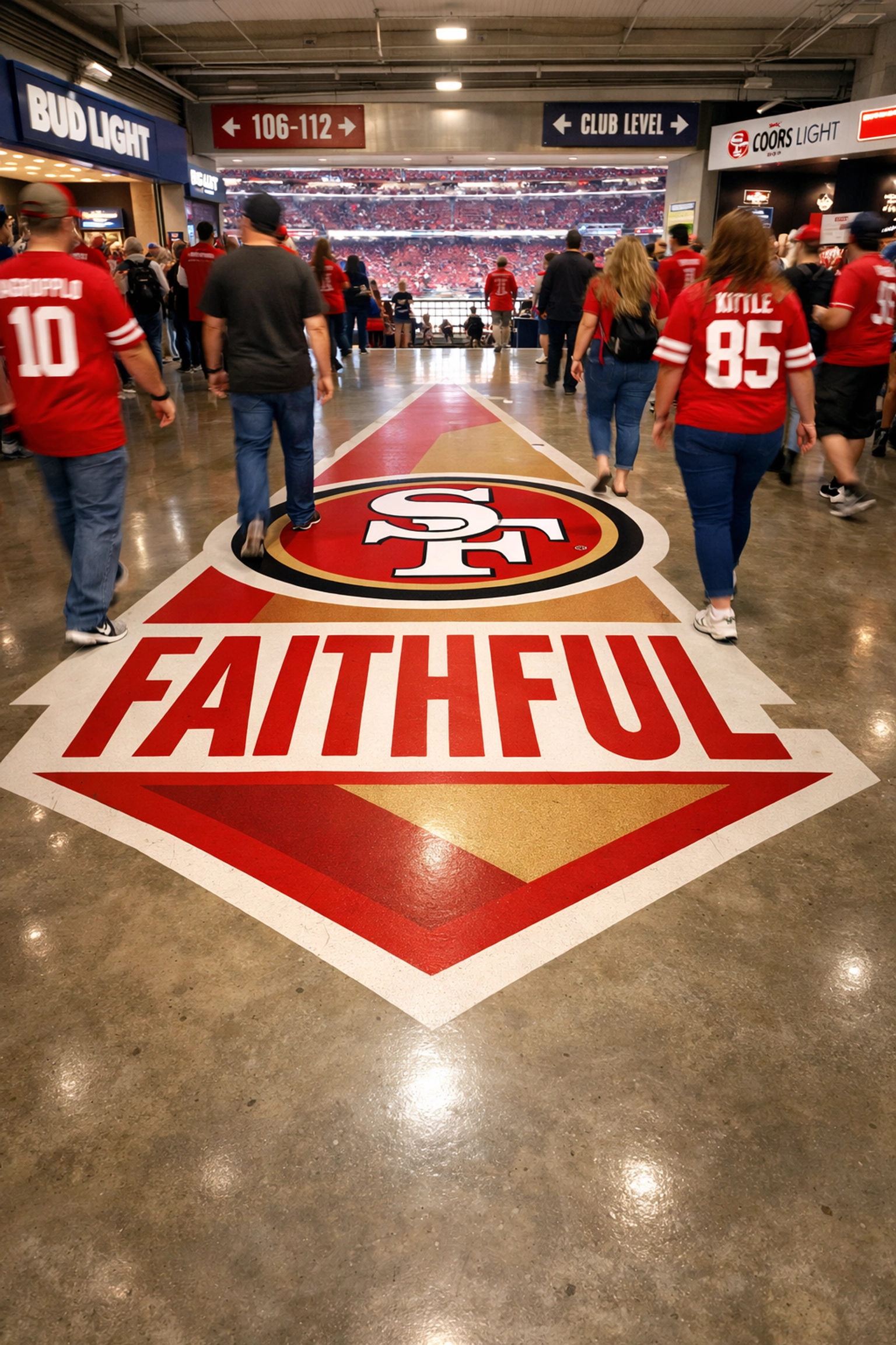 Branded floor graphics in a stadium concourse creating a venue-wide advertising experience.