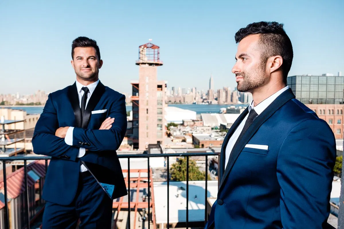 Two leaders in blue suits on a rooftop representing executive presence