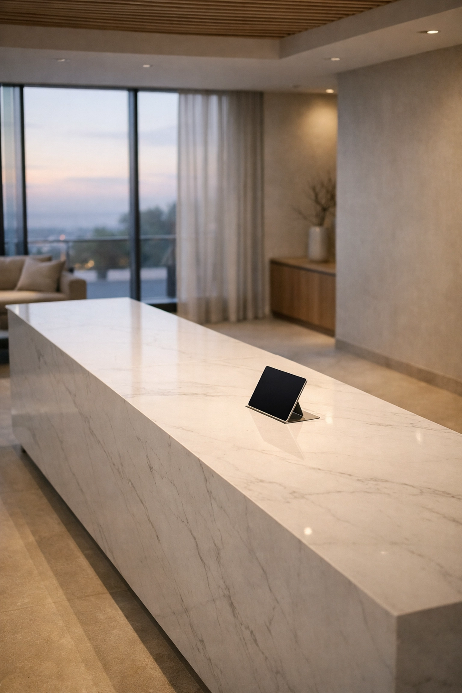 Minimalist luxury hotel lobby with a digital tablet showcasing streamlined hospitality software for better ROI.
