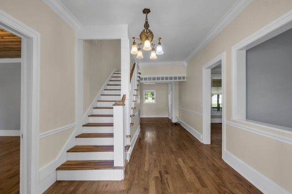 Bright entry hallway with elegant staircase