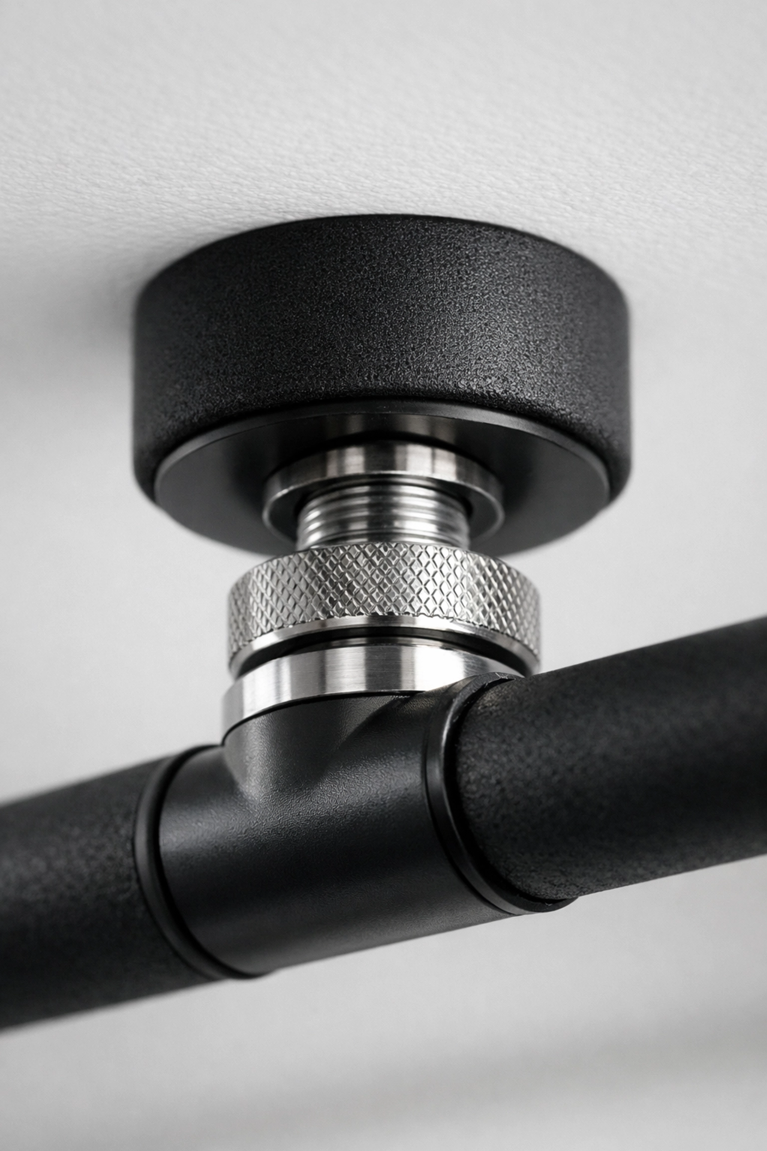 Close-up of a no wall damage workout system tension mount, a perfect pull up bar alternative for home.