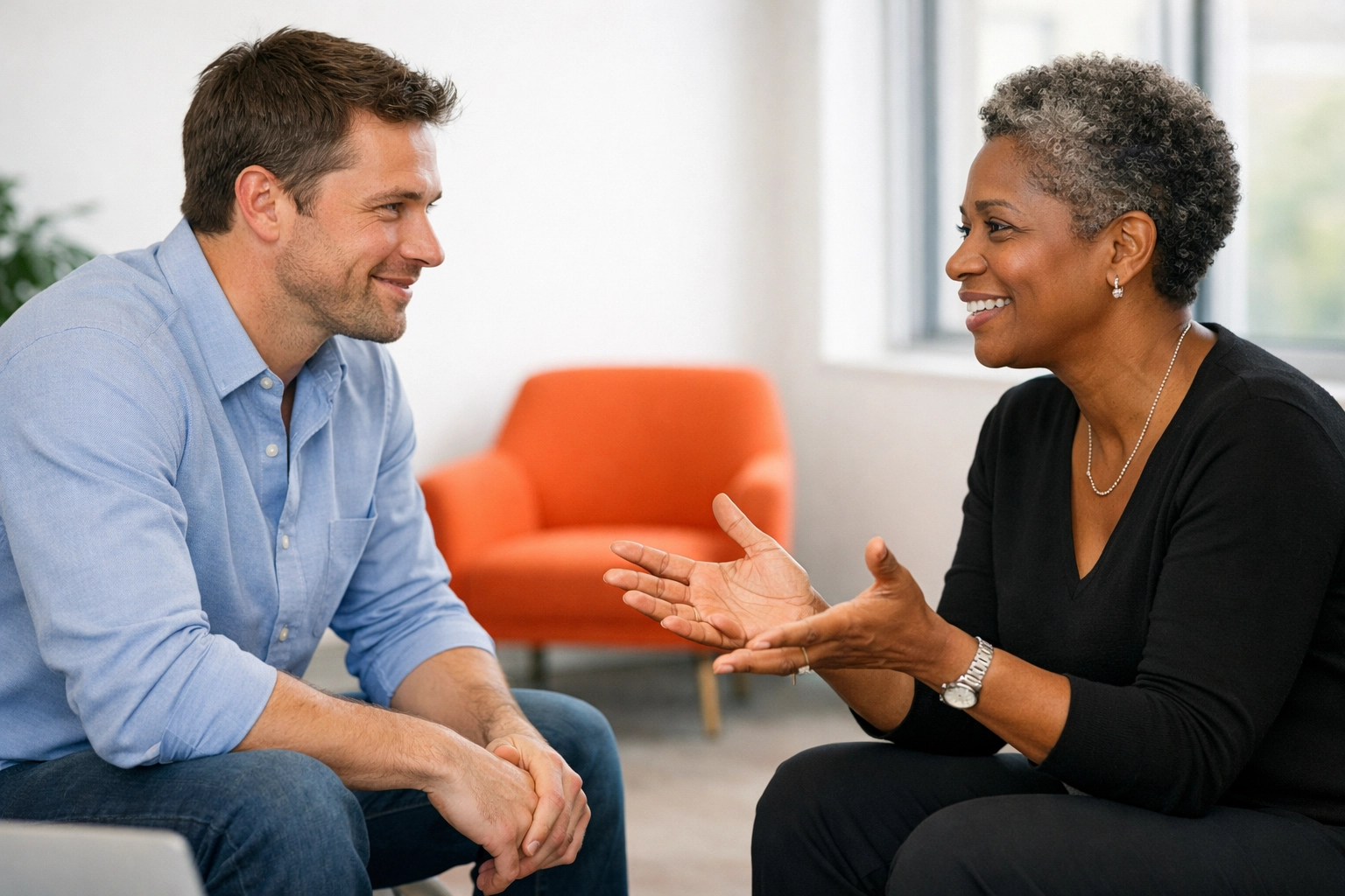 Two professionals in a relaxed conversation, demonstrating ethical sales and non-pushy communication.