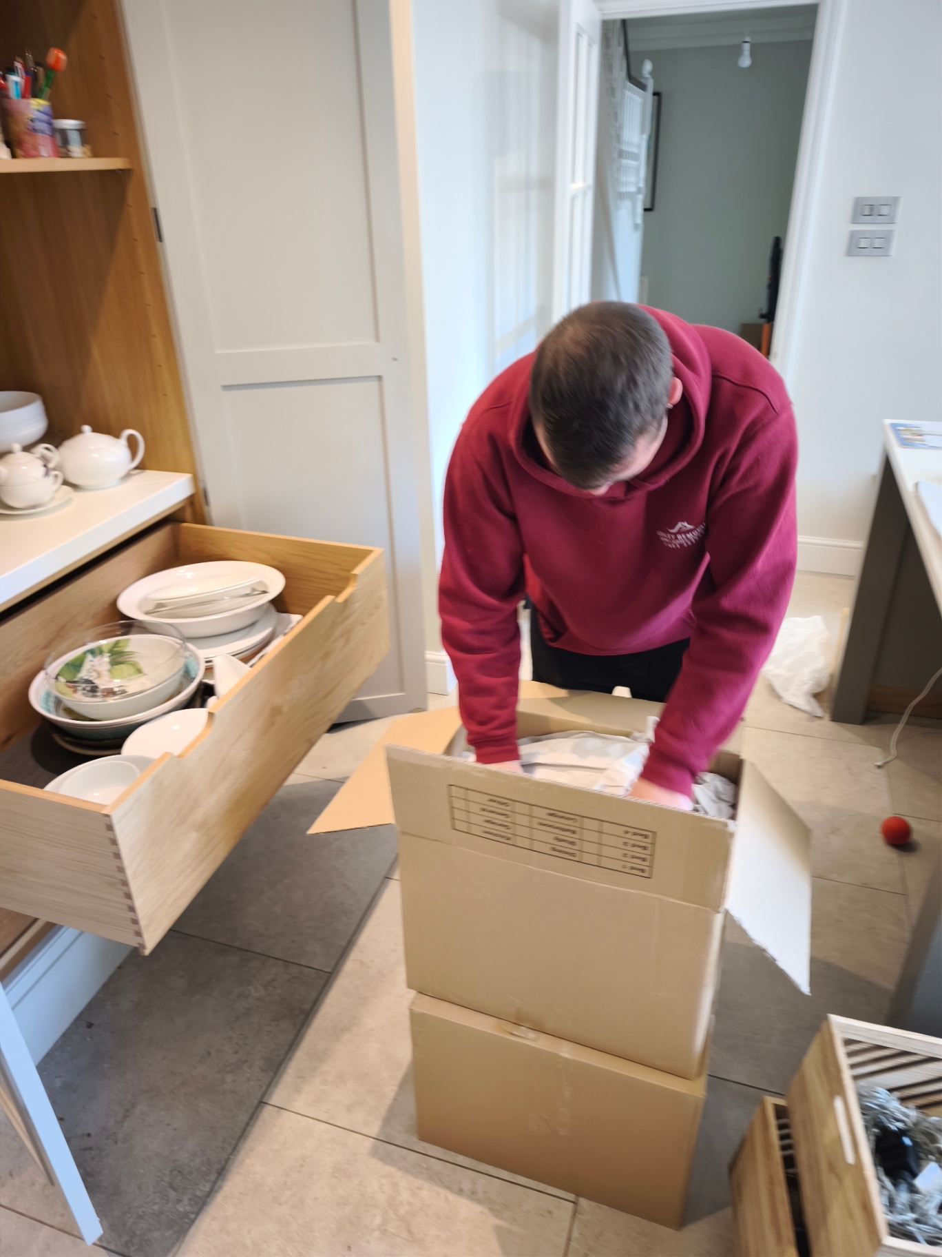 Ashley Removals team packing kitchen crockery