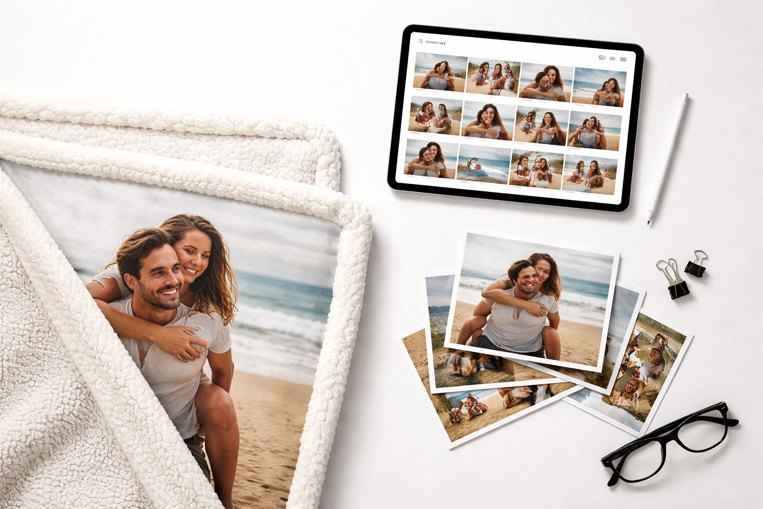 Flat-lay of sherpa blanket, tablet, and photo samples showing personalized custom blanket design process