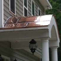 Copper roofing installed on a residential front porch