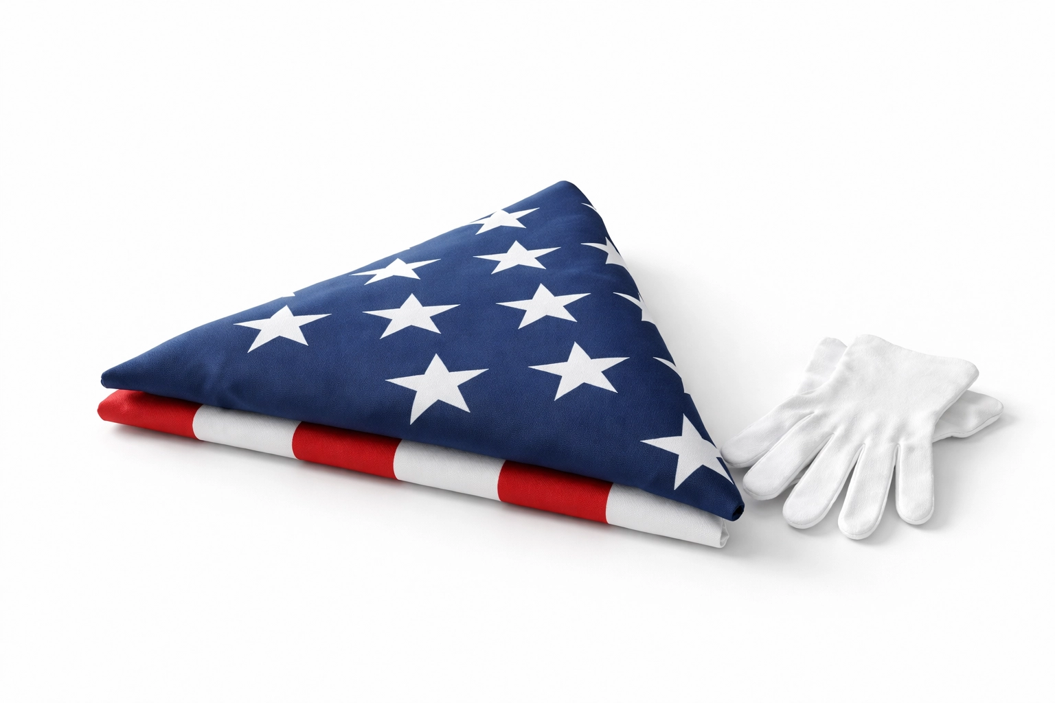 Folded American flag and white gloves honoring fallen veterans, symbolizing remembrance by American Legion Posts all year.