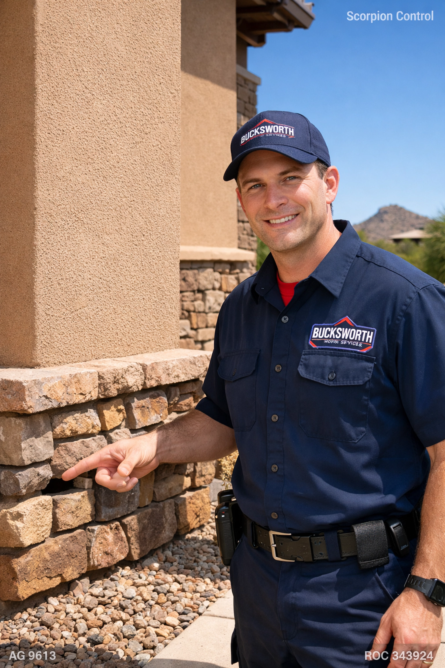 Bucksworth technician identifying a scorpion entry point in a Scottsdale home for structural sealing.
